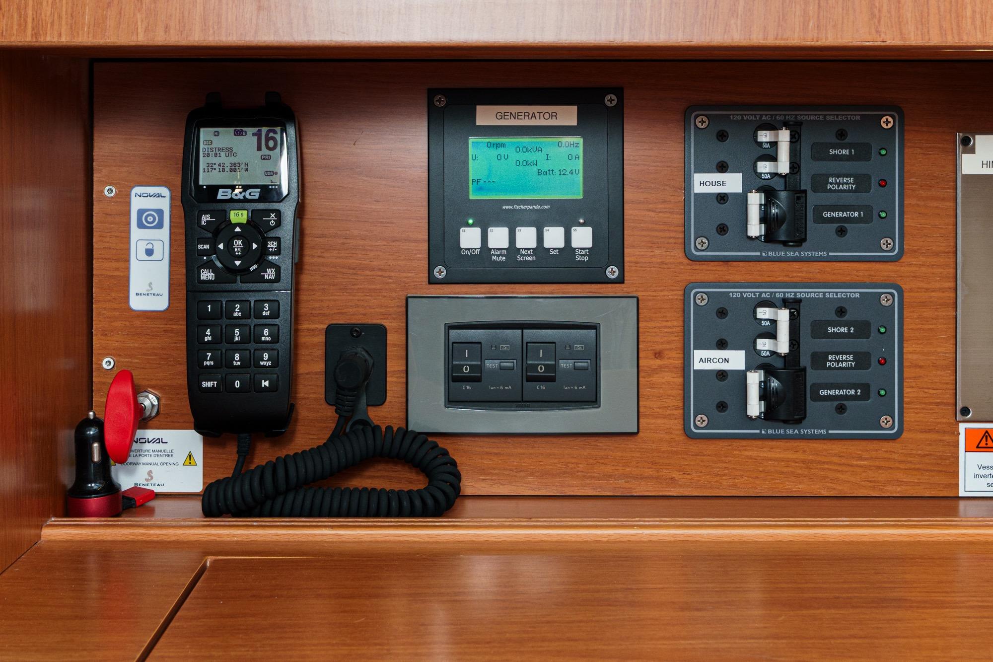 Control panel of a 2017 Beneteau Sense 50 yacht, featuring navigation and power management systems.