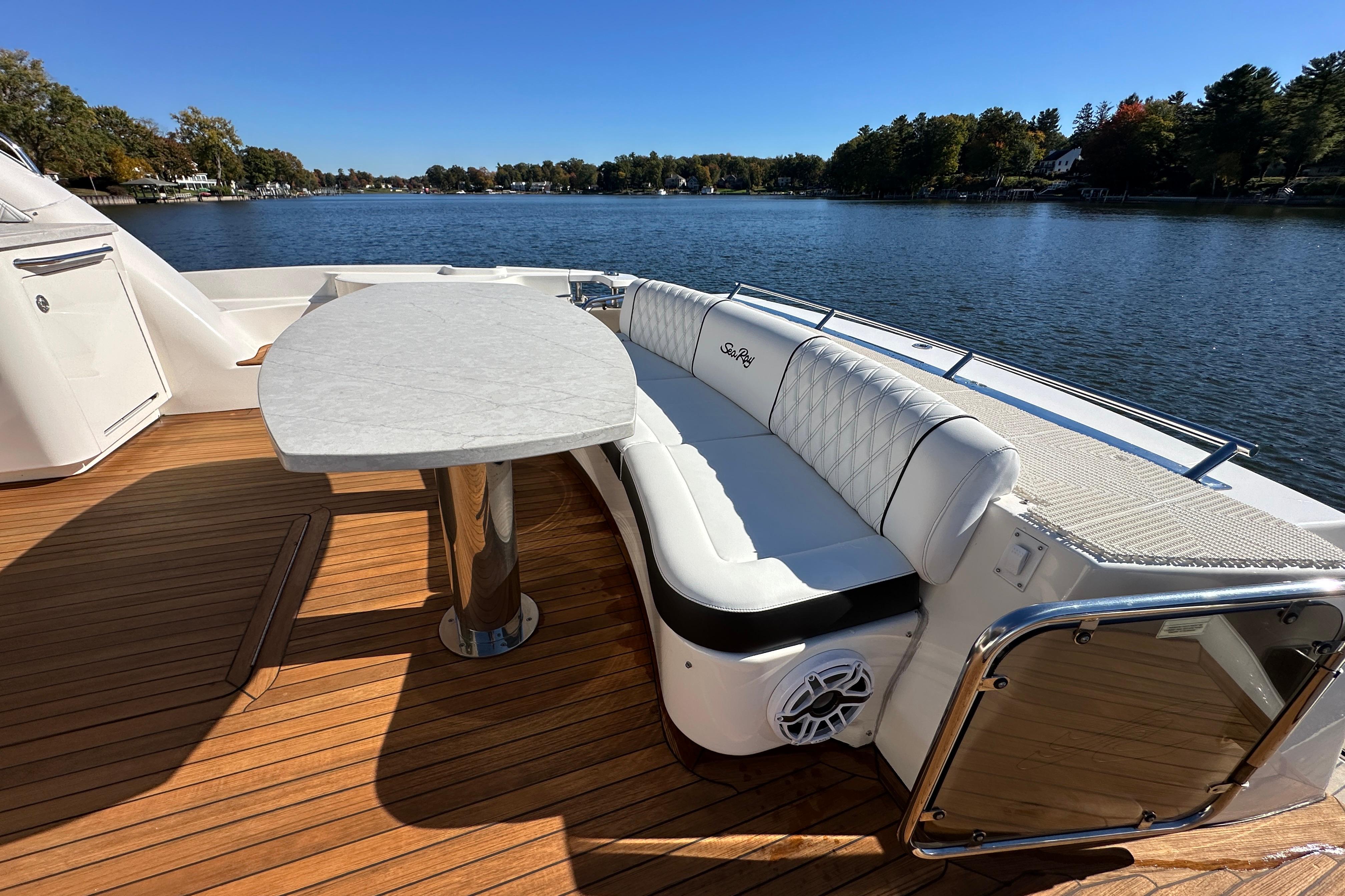 Luxurious 2007 Sea Ray 60 Sundancer yacht with elegant seating and scenic water view.
