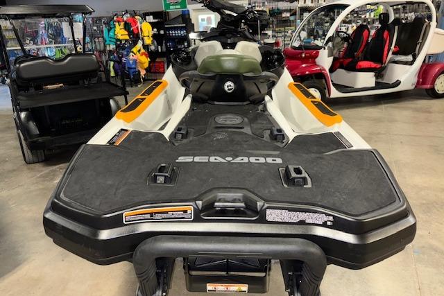 2020 Sea-Doo FISH PRO jet ski in showroom, surrounded by various vehicles and equipment.