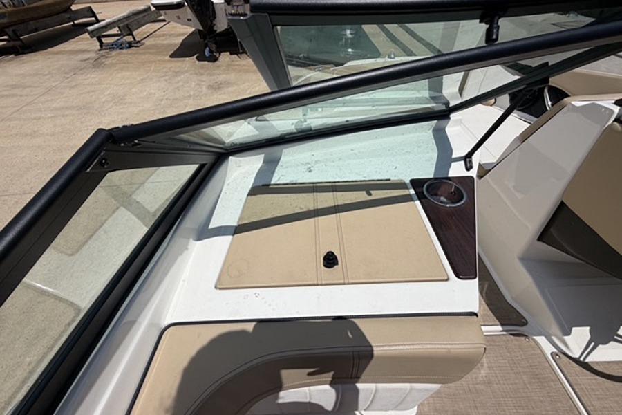 2018 Sea Ray SPX 190 boat interior with beige seating and cup holder.