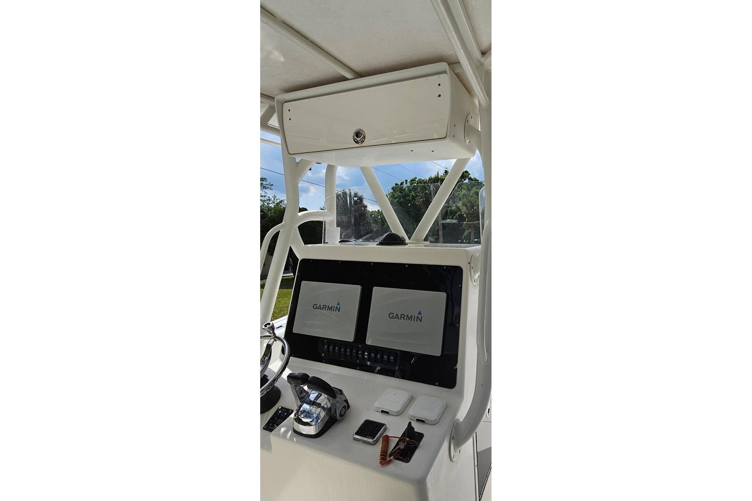 2002 Yellowfin 31 Center Console boat dashboard with Garmin navigation system.