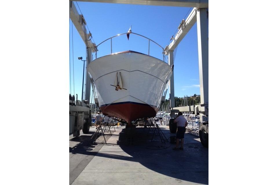 1958 Chris-Craft 48 Constellation yacht in dry dock for maintenance.