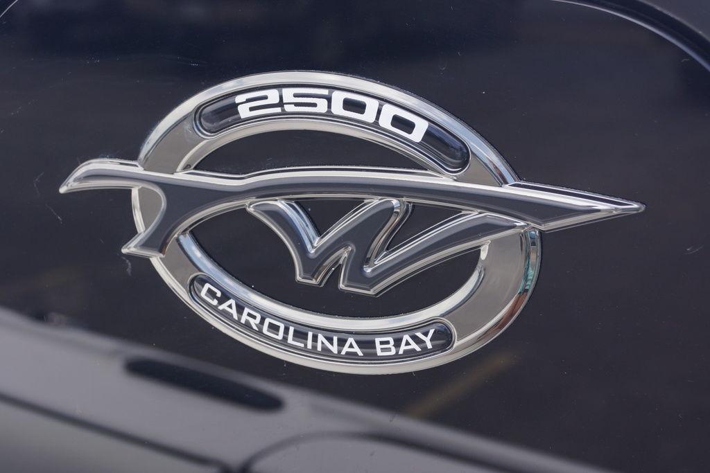 Emblem of 2027 Tidewater 2500 Carolina Bay boat, featuring sleek silver design.