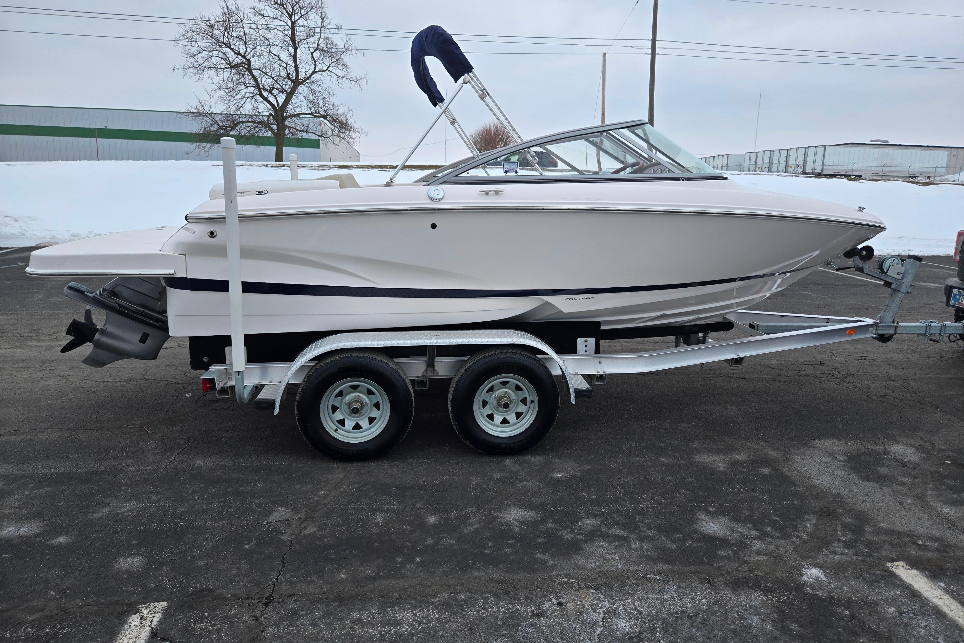2015 Regal 1900 ES Bowrider on trailer in snowy parking lot.