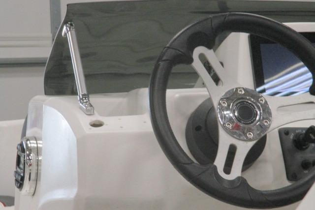 2024 Tahoe T16 boat steering wheel and dashboard close-up.