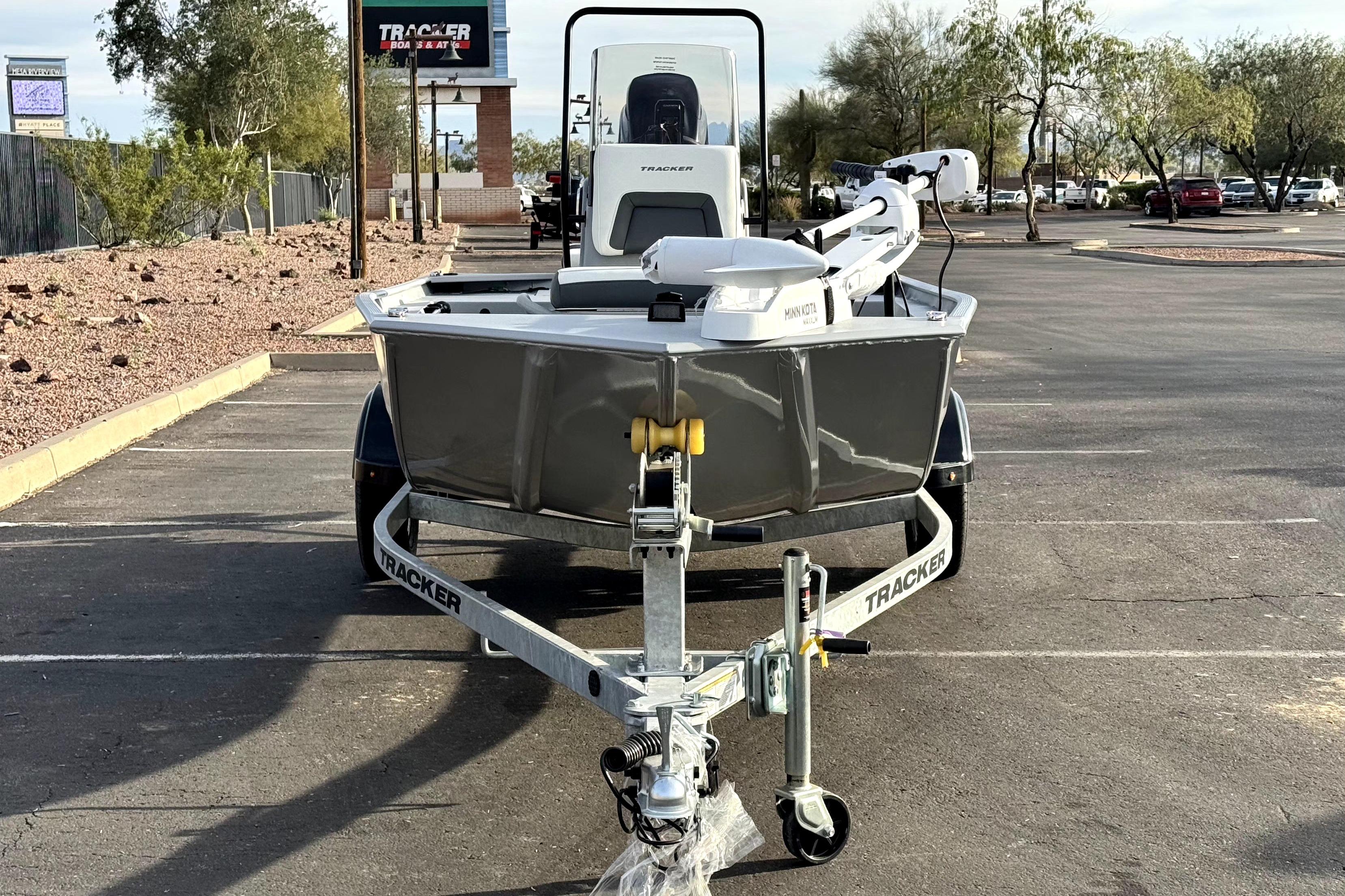 2026 Tracker Bass Tracker Classic CC boat on trailer in parking lot.