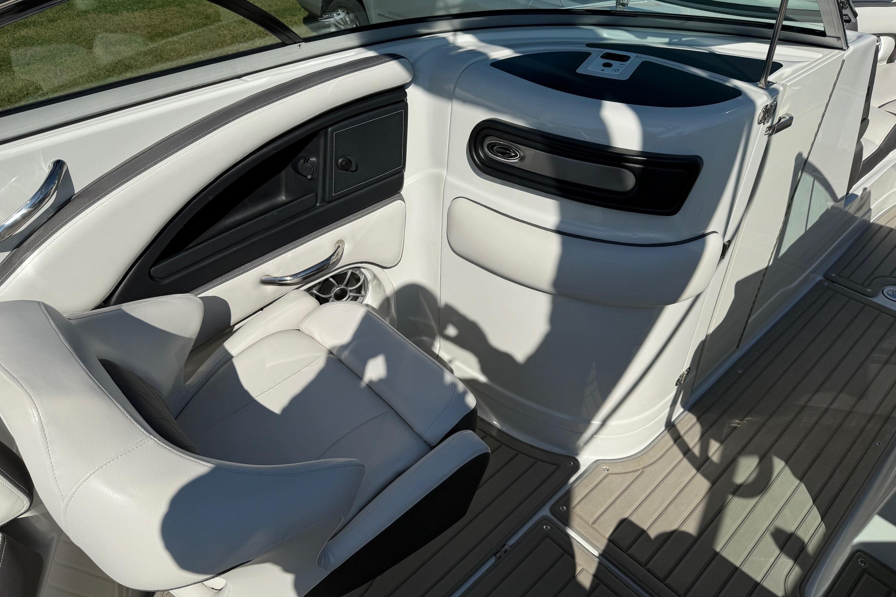 2023 Crownline 290 SS boat interior with white seating and sleek dashboard design.