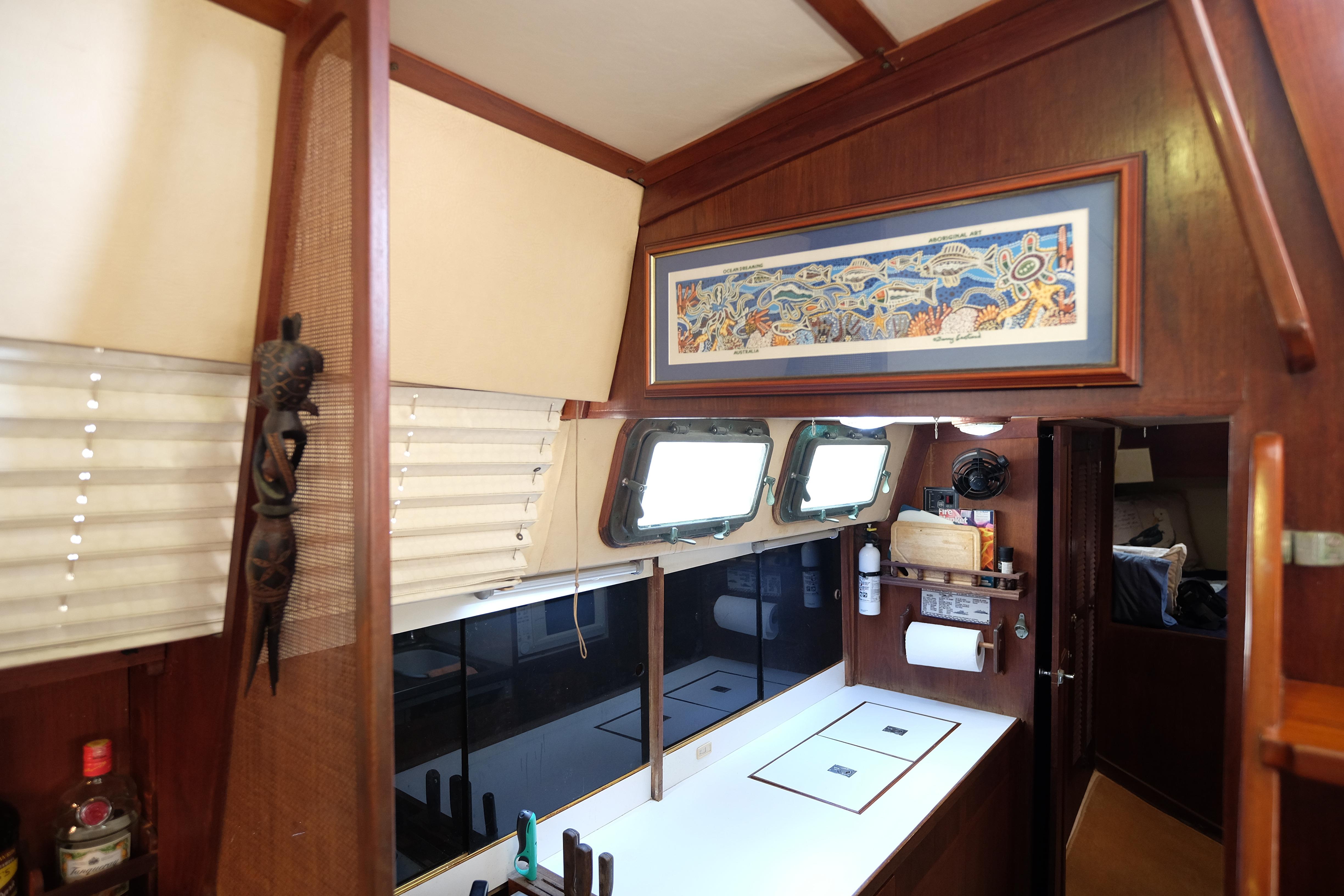 Interior of 1976 CAL 3-46 FT Center Cockpit Ketch with nautical decor and wooden finishes.