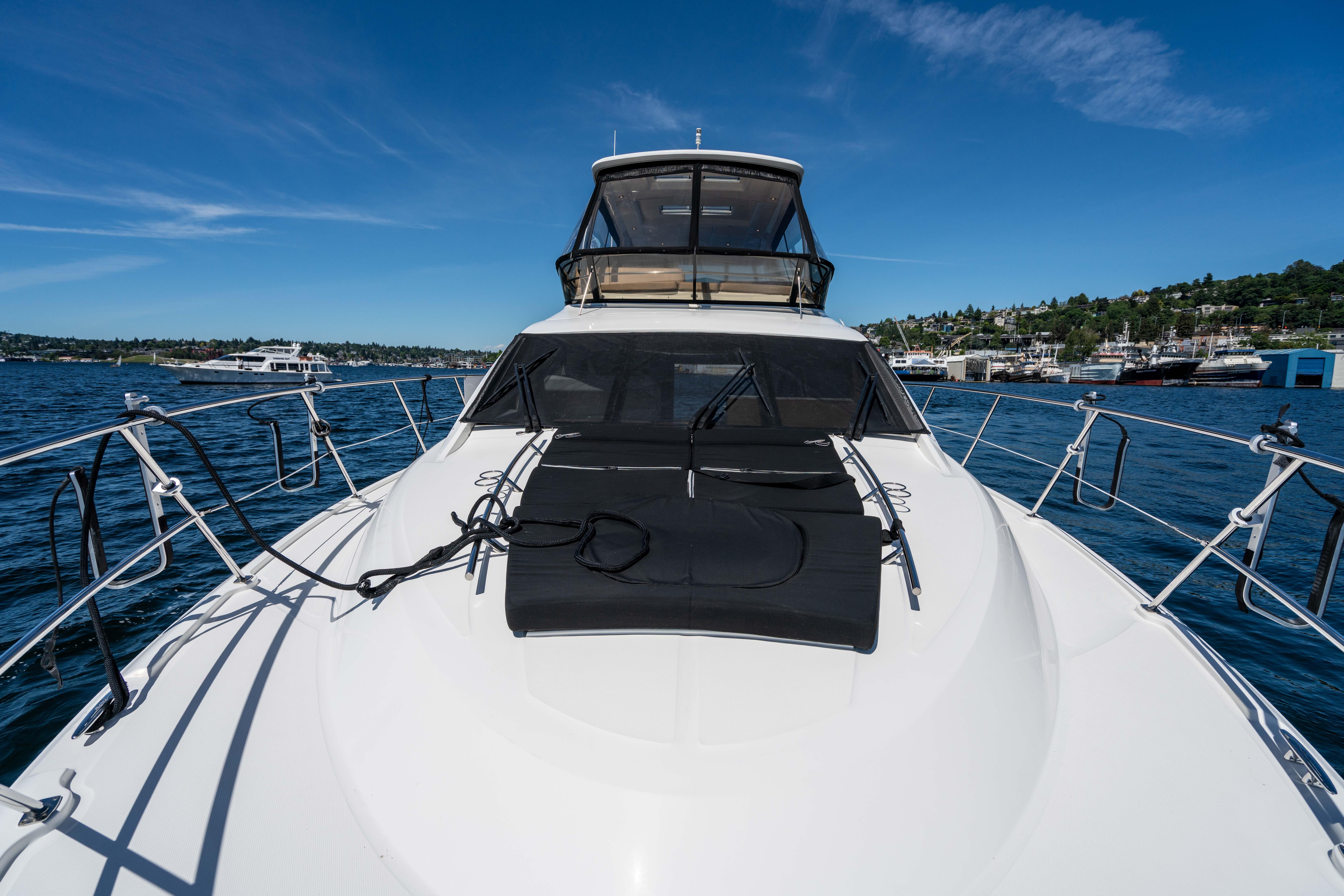 2017 Sea Ray 510 Fly yacht on water, sunny day, scenic background.