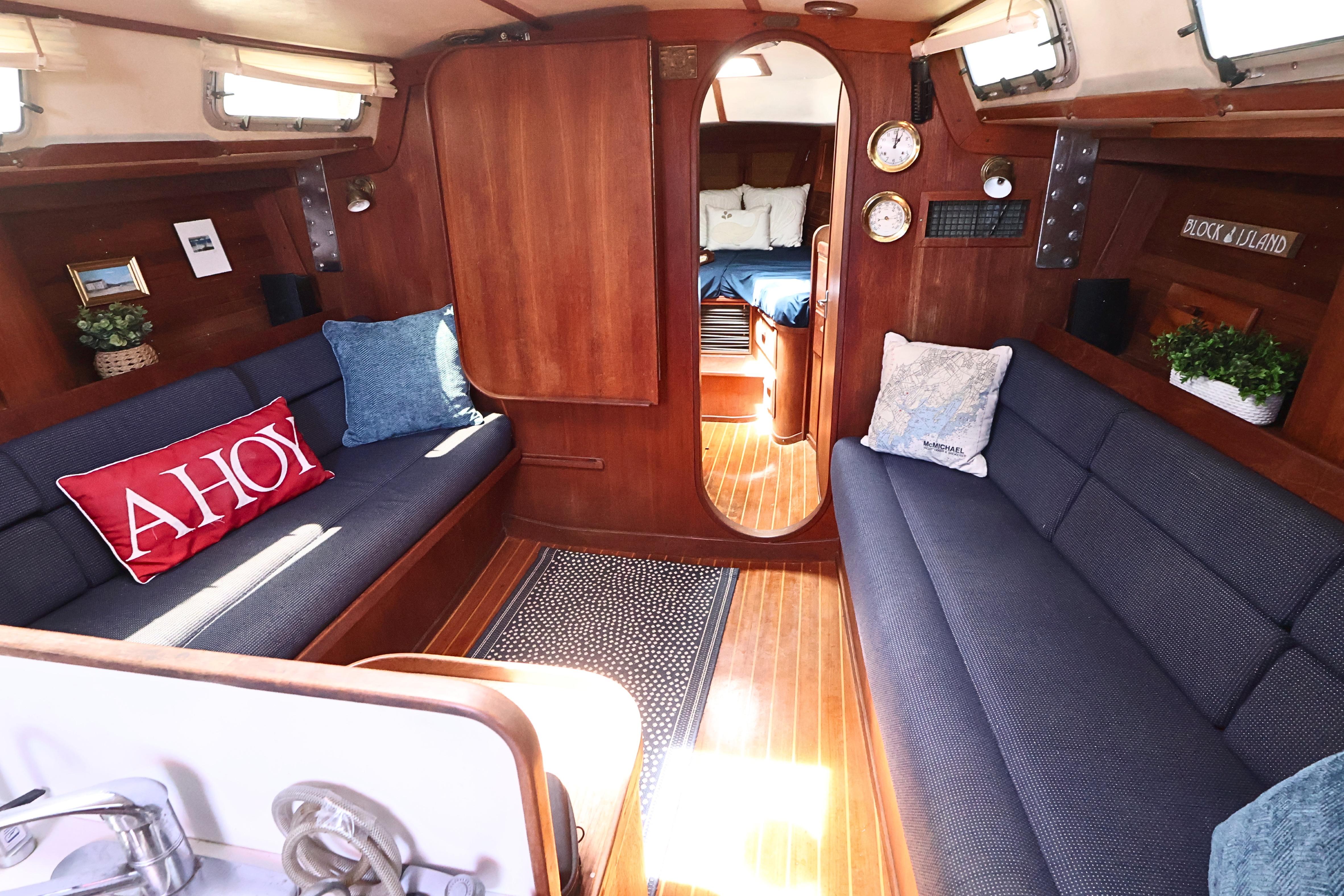 Cozy interior of 1989 J Boat J 40 sailboat with wooden finish and nautical decor.