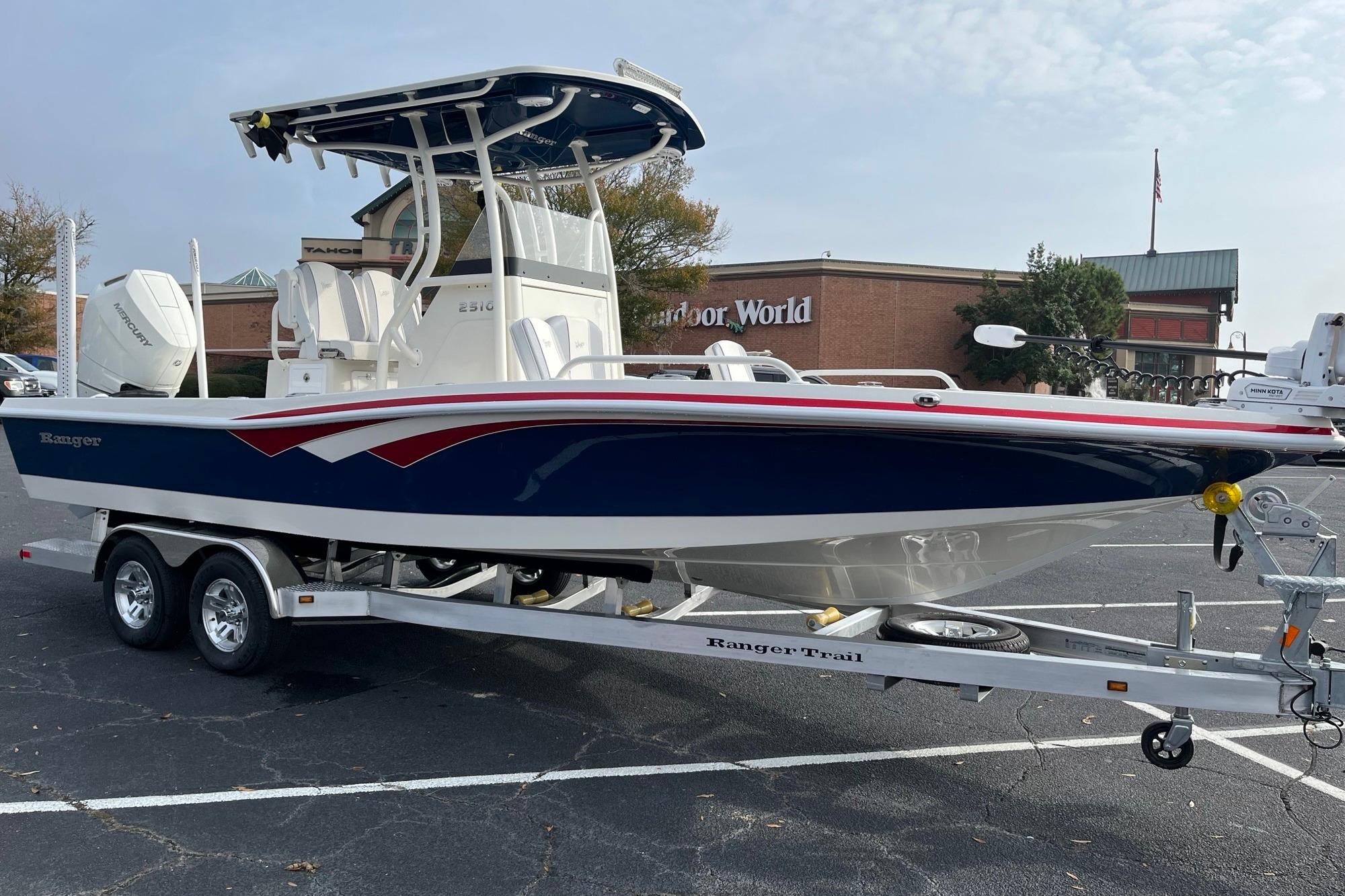 2026 Ranger 2510 Bay boat on trailer in parking lot, near Outdoor World.