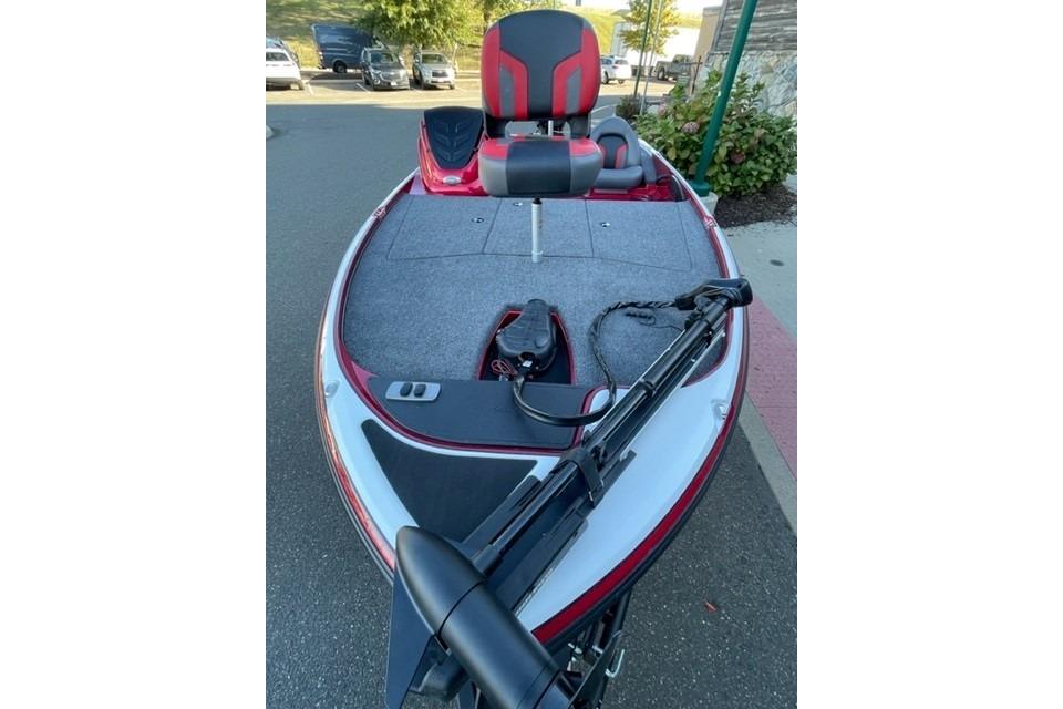2026 Nitro Z17 boat with red and gray seating, parked outdoors.
