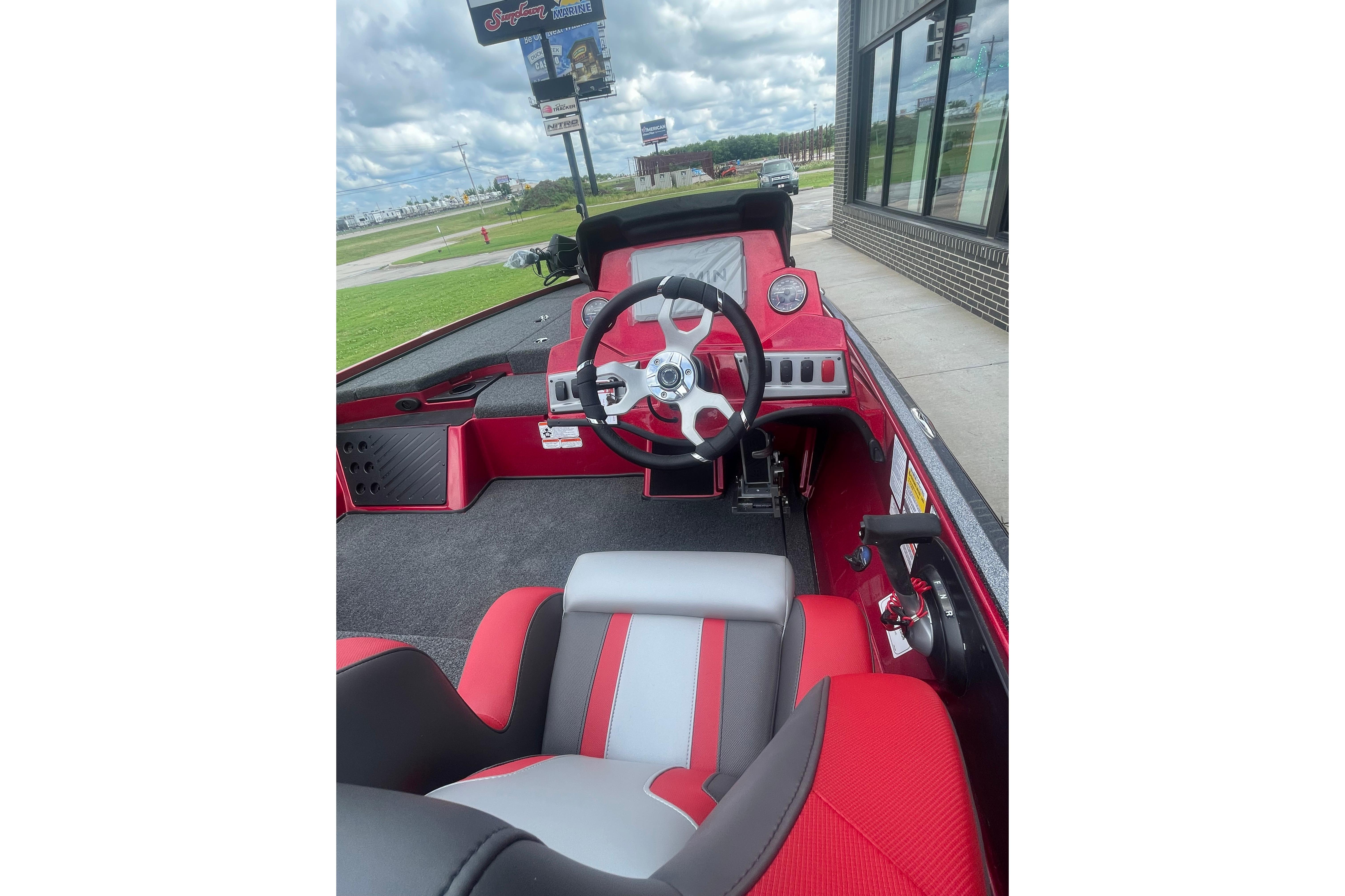 Interior of a 2026 Nitro Z18 Pro boat with red and gray seating.