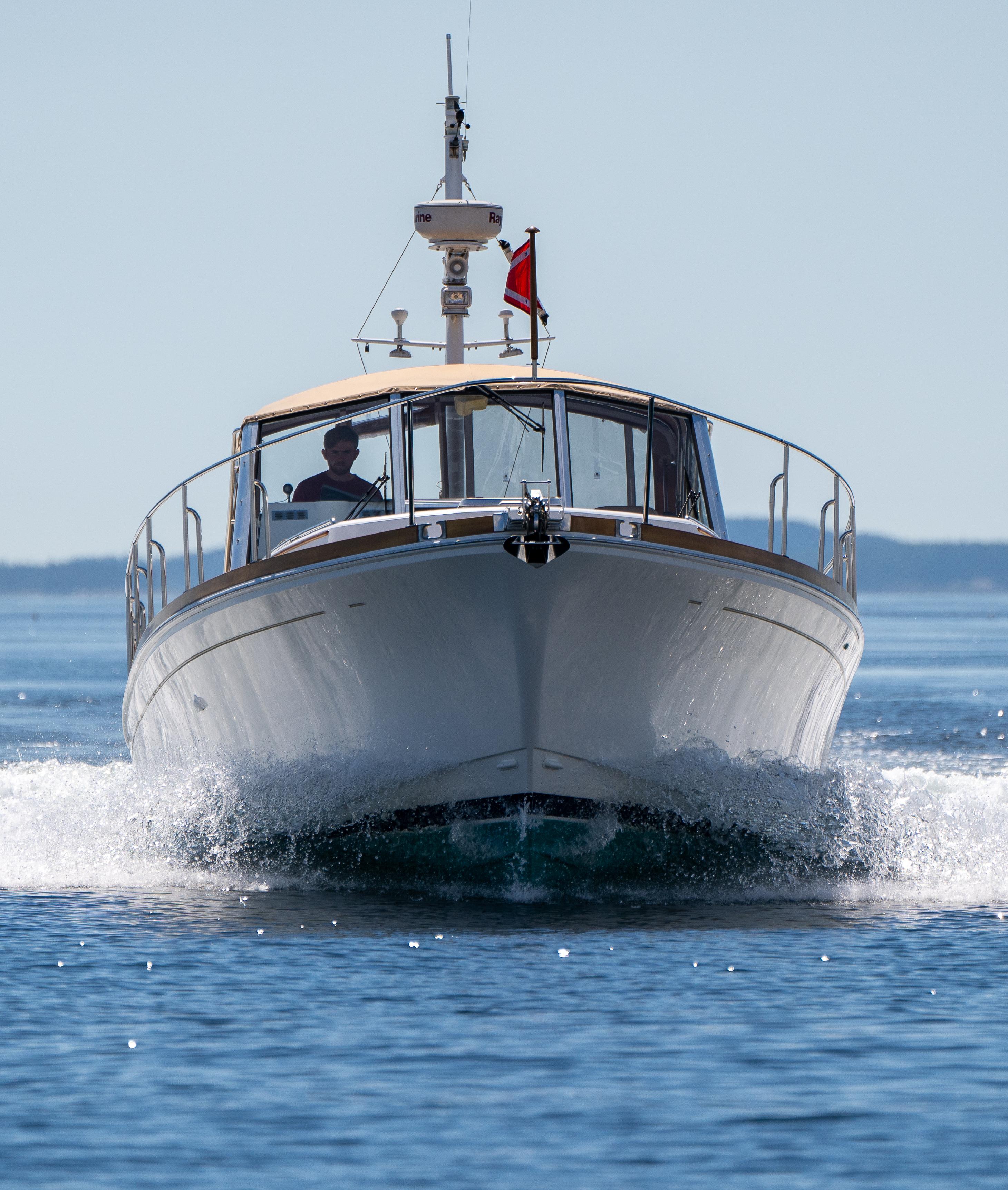 2000 Grand Banks Eastbay 43 Ex cruising on open water.