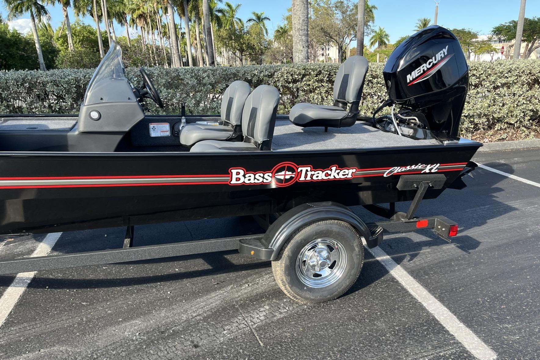 2026 Tracker Bass Tracker Classic XL boat with Mercury engine in a parking lot.