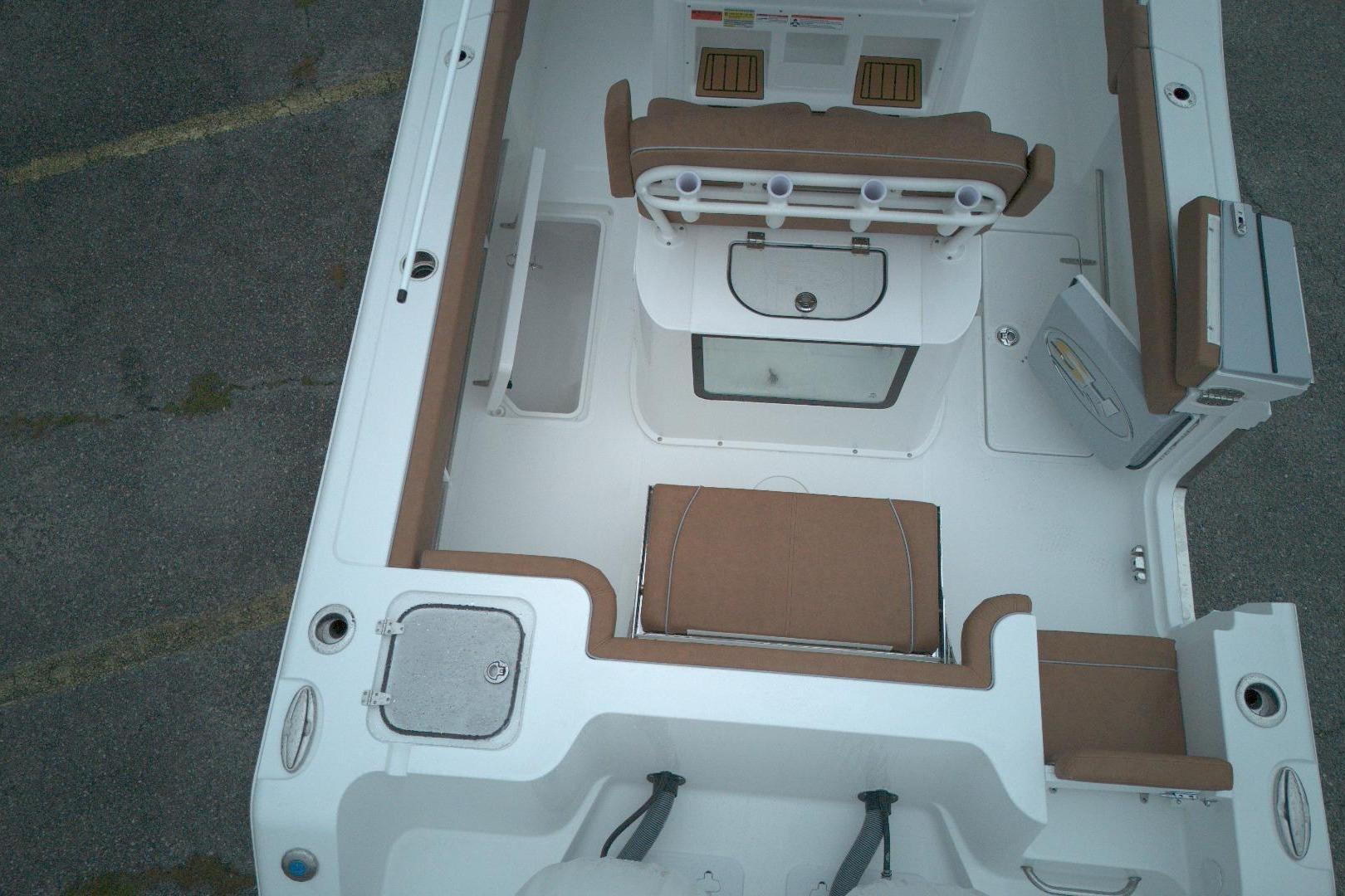 2026 Sea Hunt Gamefish 25 boat interior with seating and storage compartments.