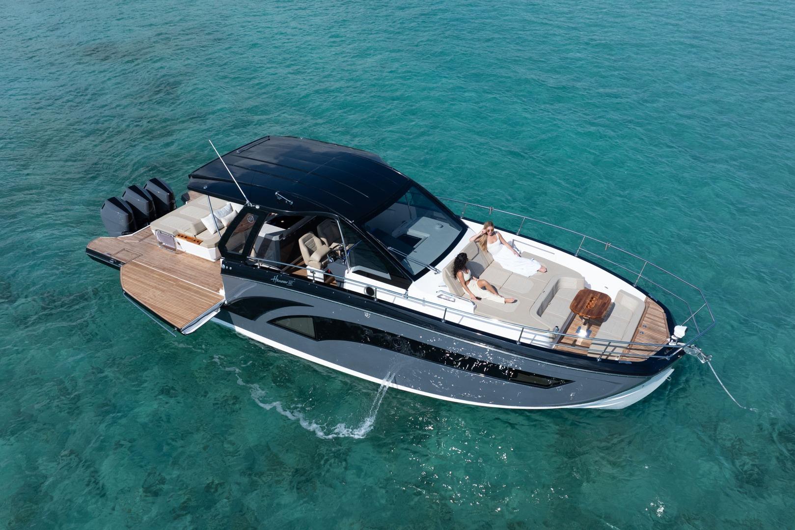 Luxurious 2026 Hanover 447 yacht cruising on clear turquoise waters.