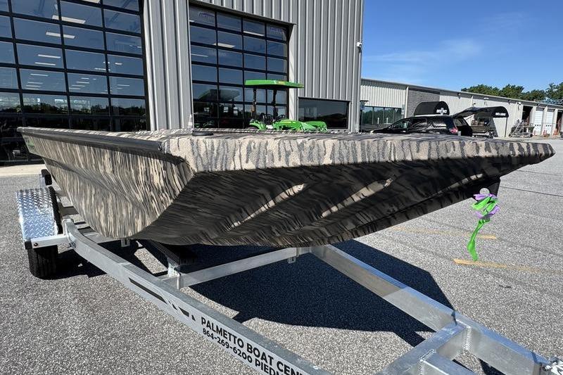 2026 Havoc 1656 MRST MACH 1 boat on trailer, parked outside dealership.