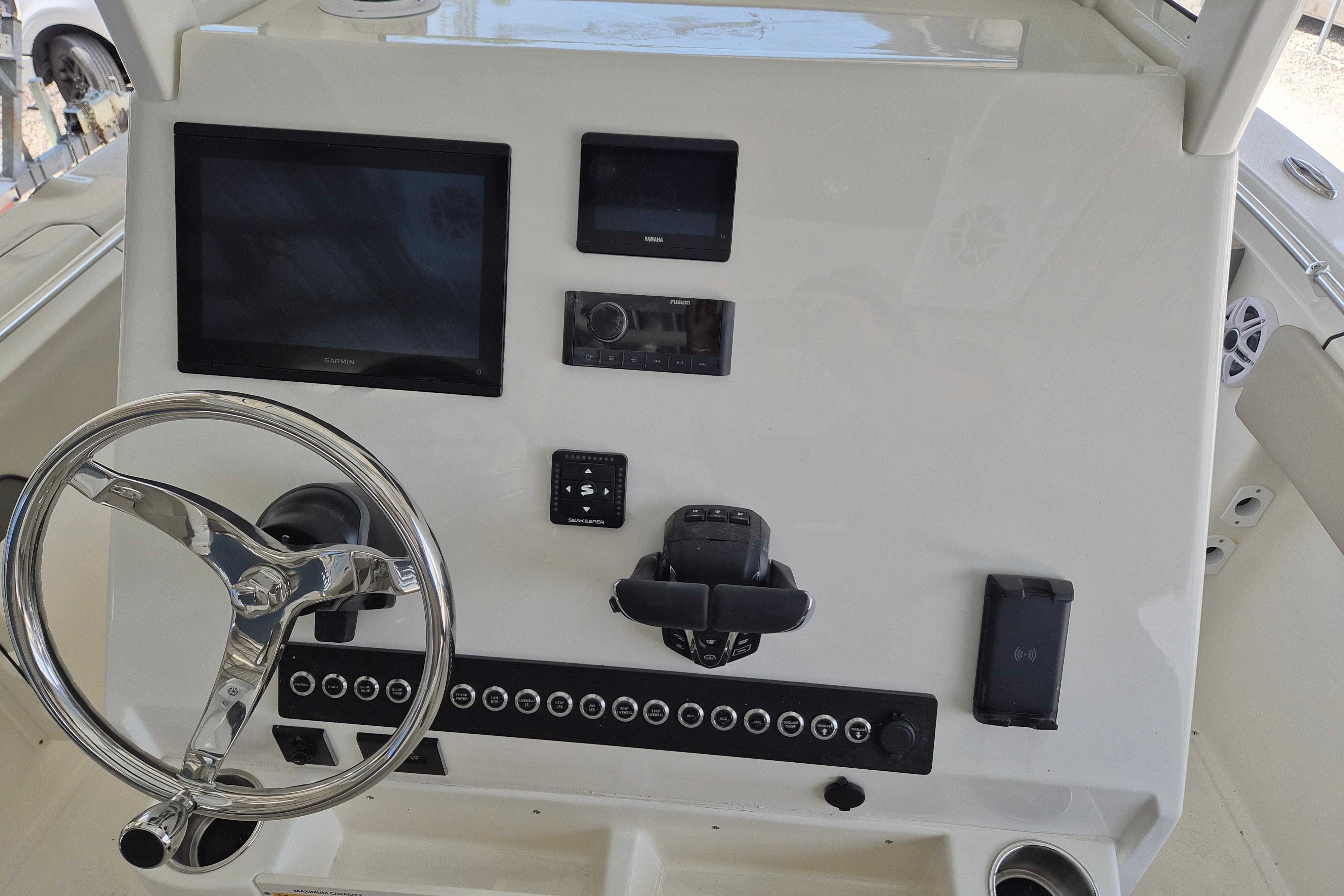2026 Key West 260 Center Console dashboard with steering wheel and electronic displays.