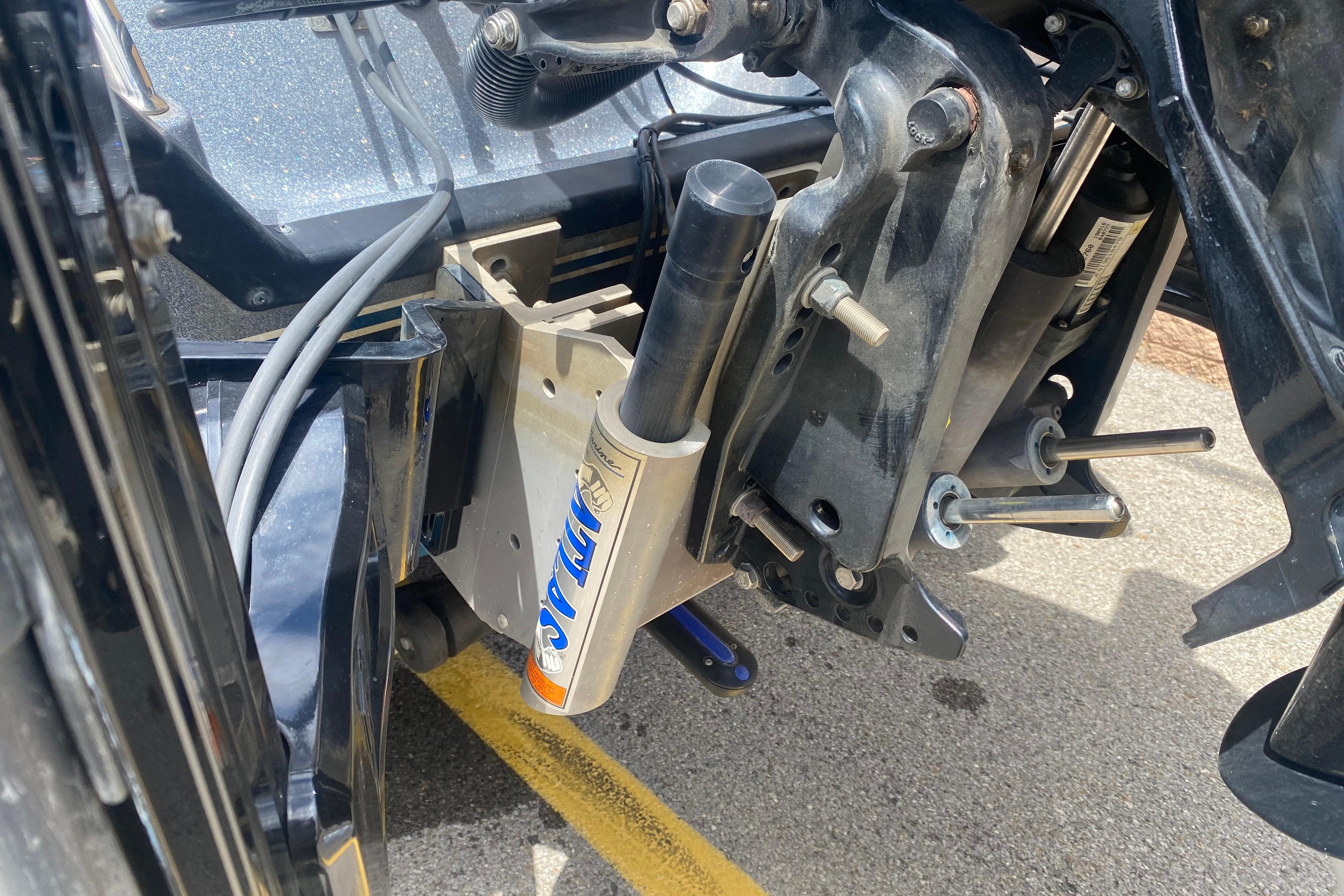 Close-up of 2020 Triton 20 TrX Patriot boat engine mount and hydraulic system.