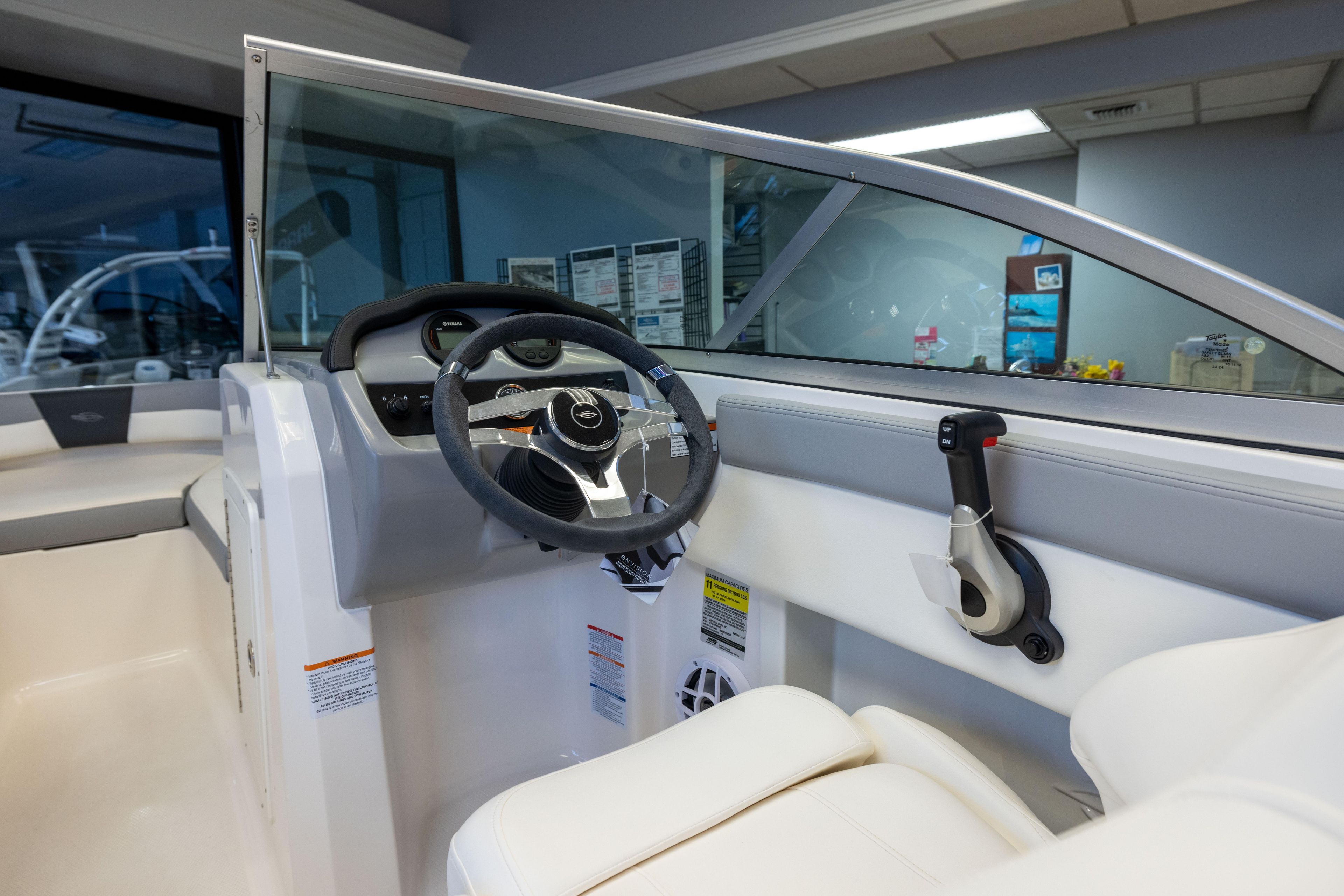 2024 Chaparral 19 SSi OB boat interior with steering wheel and control panel.