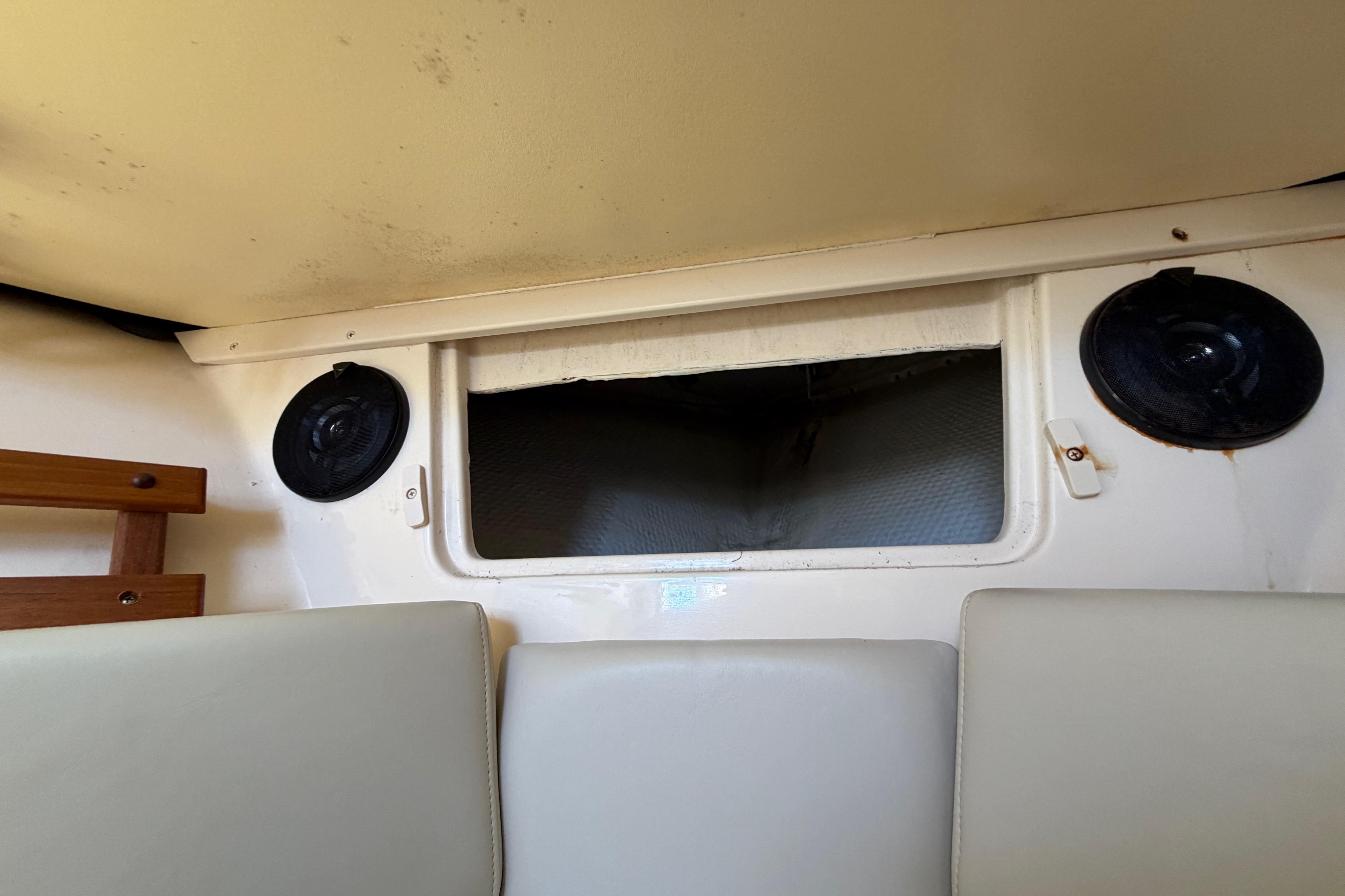 Interior of 2006 Grady-White Sailfish 282 boat, featuring speakers and seating.