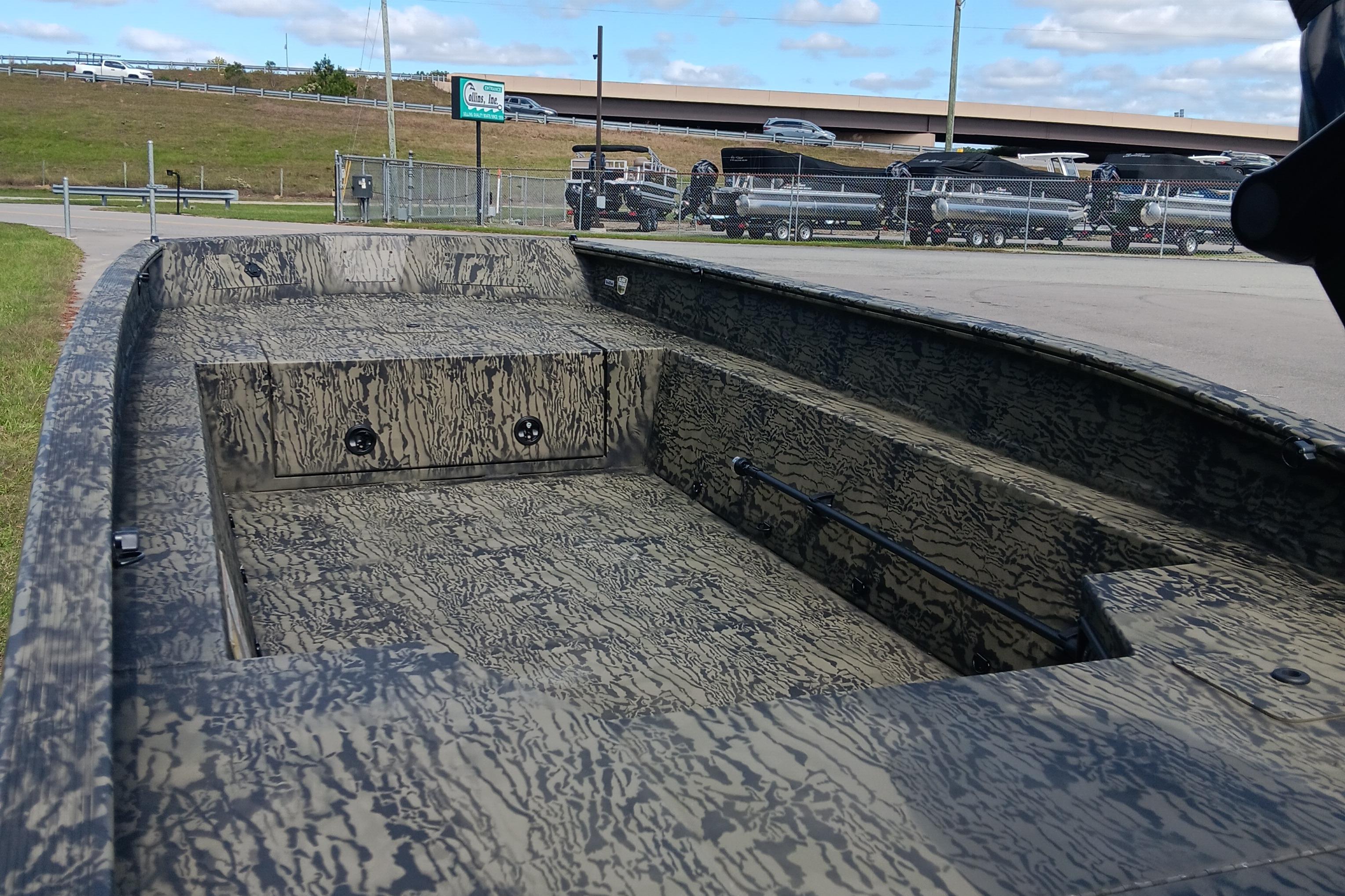 2026 Tracker Grizzly 1650 T Prairie Wings Edition boat with camouflage interior design.