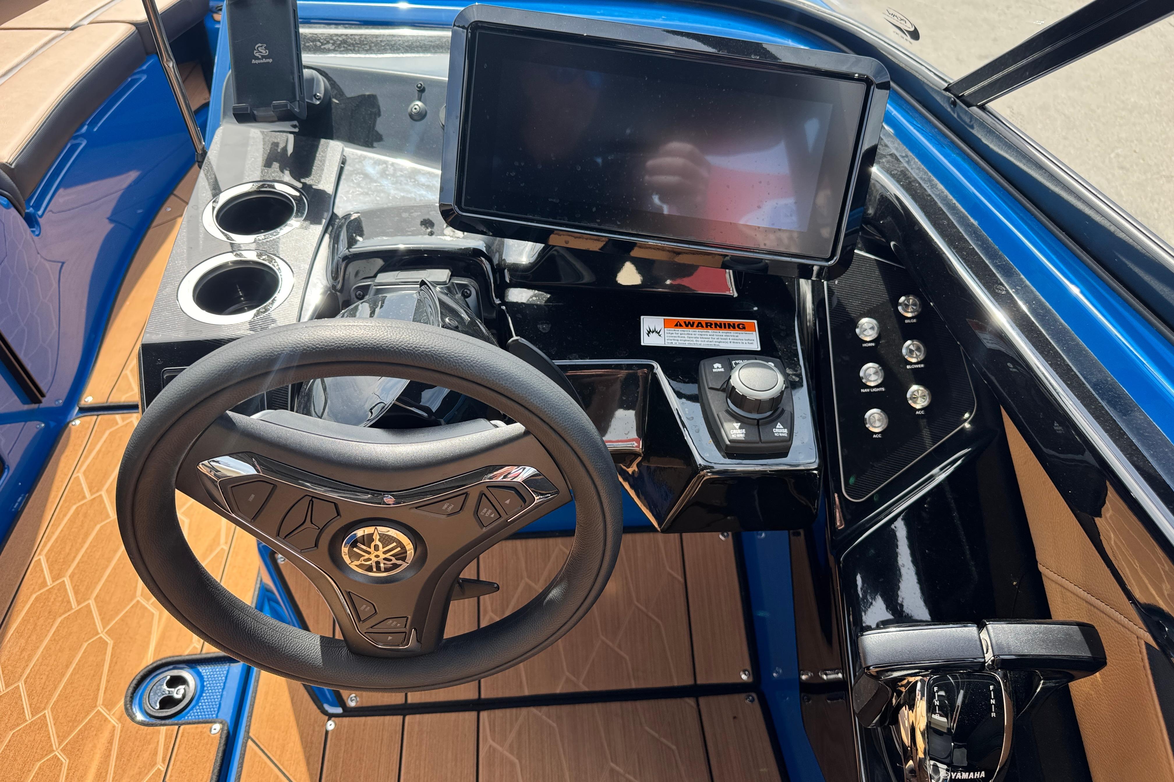 2026 Yamaha Boats 255XD dashboard with steering wheel, touchscreen, and controls.