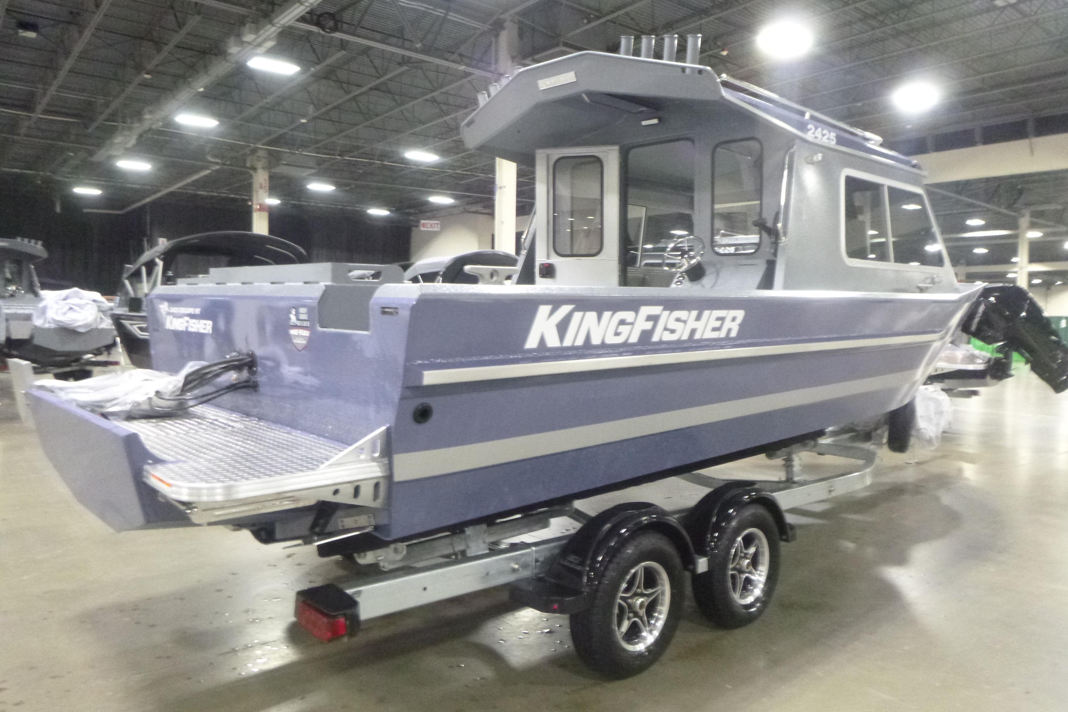 2026 KingFisher 2425 Escape HT boat on trailer in indoor showroom.