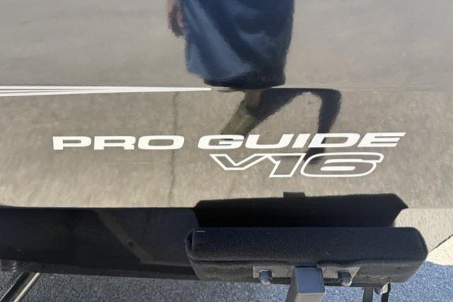 2026 Tracker Pro Guide V-16 SC boat logo on a dark surface.