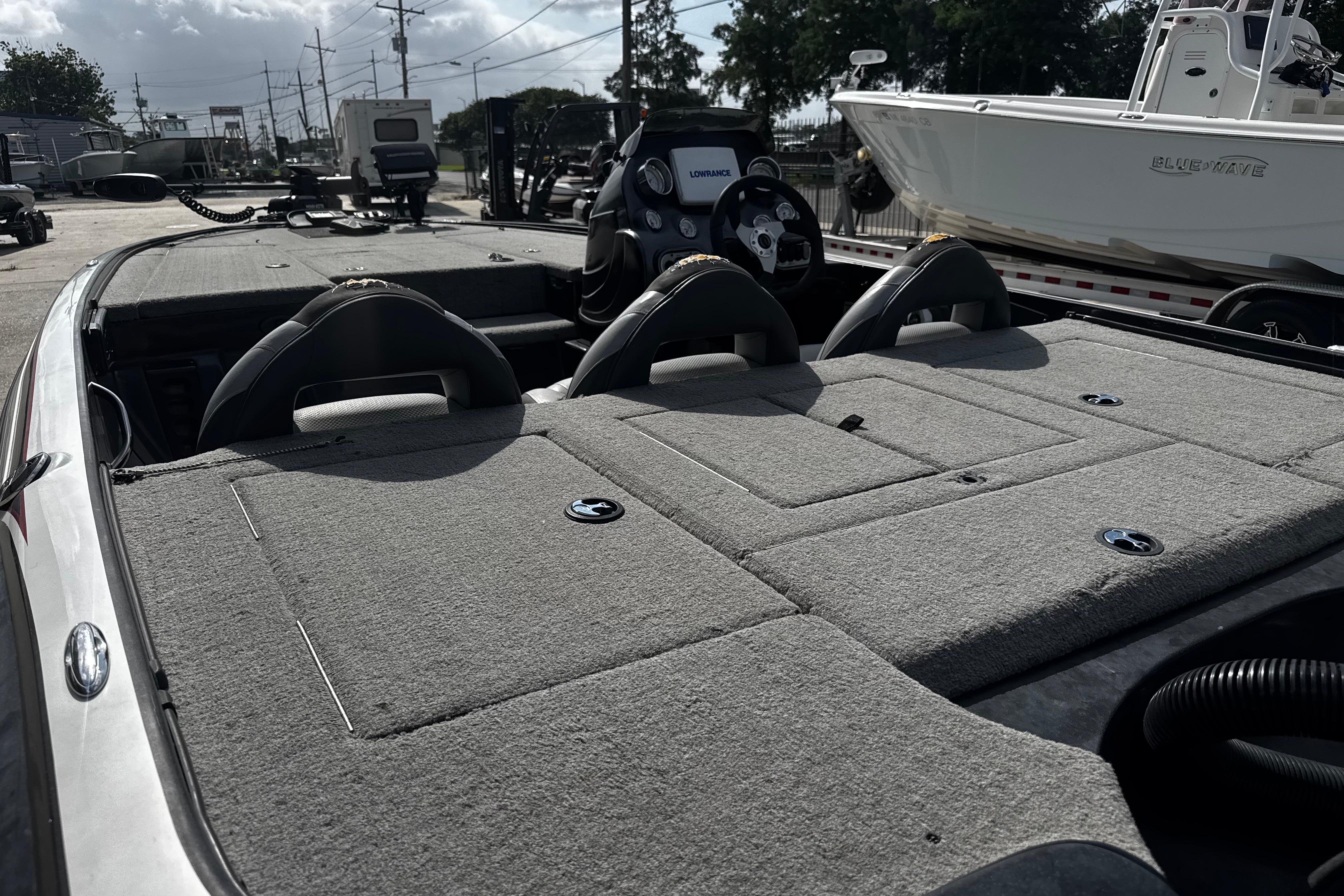 2012 Nitro Z-7 boat interior with carpeted deck and steering console.