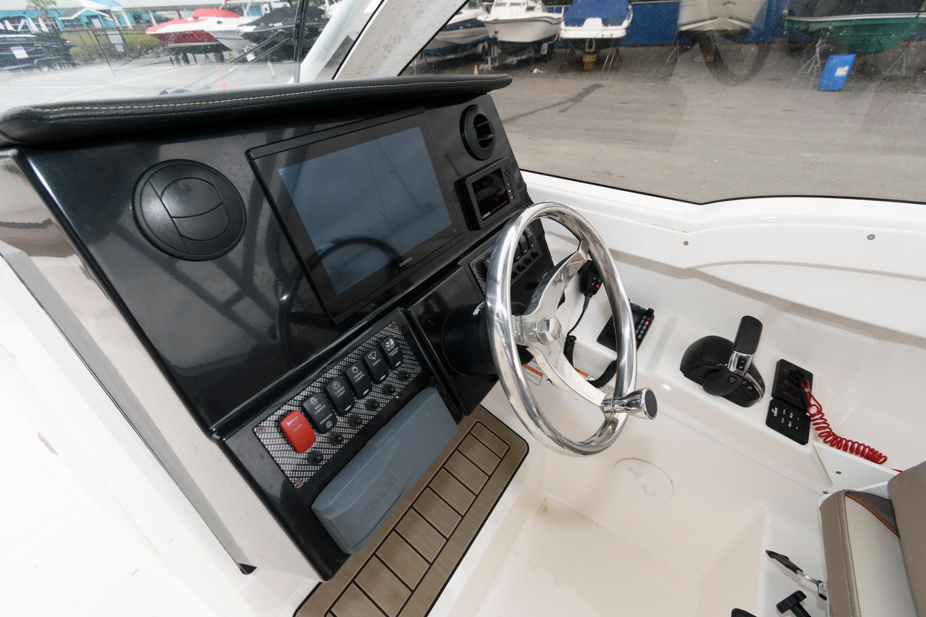 2021 Cutwater C-24 DC boat dashboard with steering wheel and control panel.