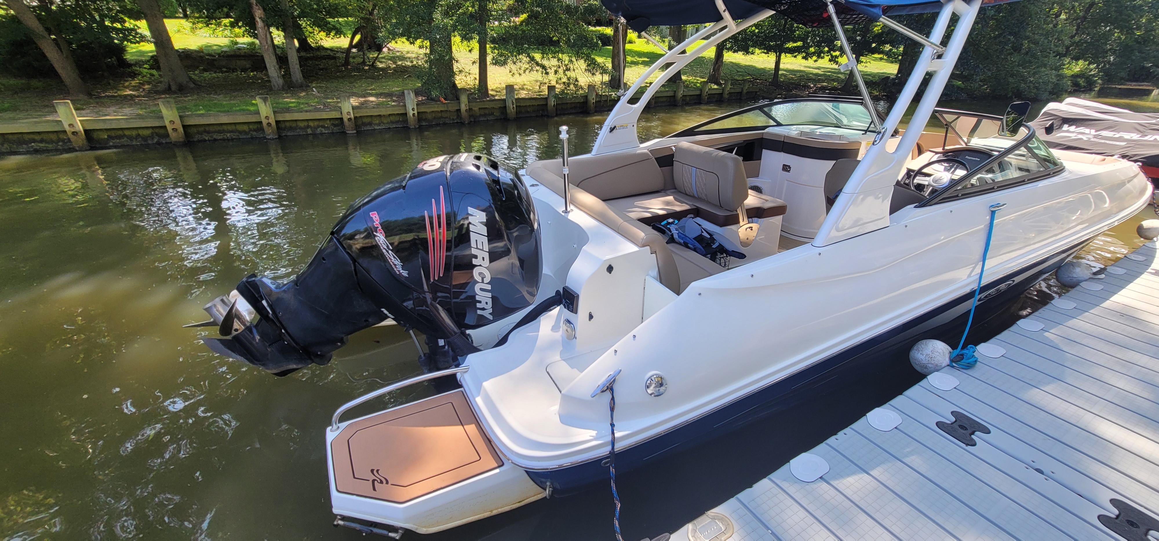 2017 Sea Ray SDX 240 Outboard boat docked, featuring a sleek design and powerful Mercury engine.
