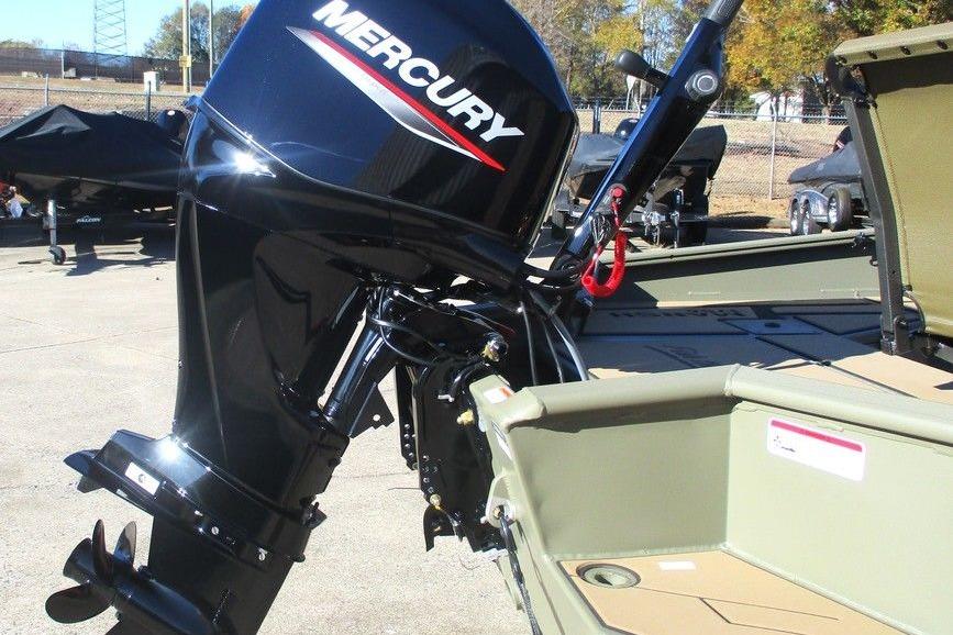 2026 Tracker Grizzly 1756 T Marsh boat with Mercury outboard motor, parked outdoors.