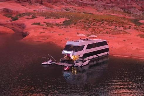 Luxurious Adonia "The Queen Elizabeth" houseboat docked on serene waters, 2021 model.