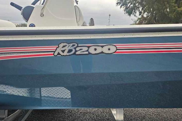 2026 Ranger RB200 boat with blue hull and red-white stripes.
