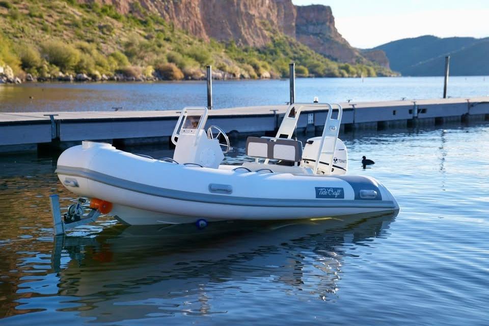 Tide Craft San Juan 11 boat docked on a serene lake, 2027 model.