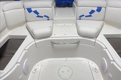 1999 Tide Craft Trophy Angler boat interior with white seating and blue accents.