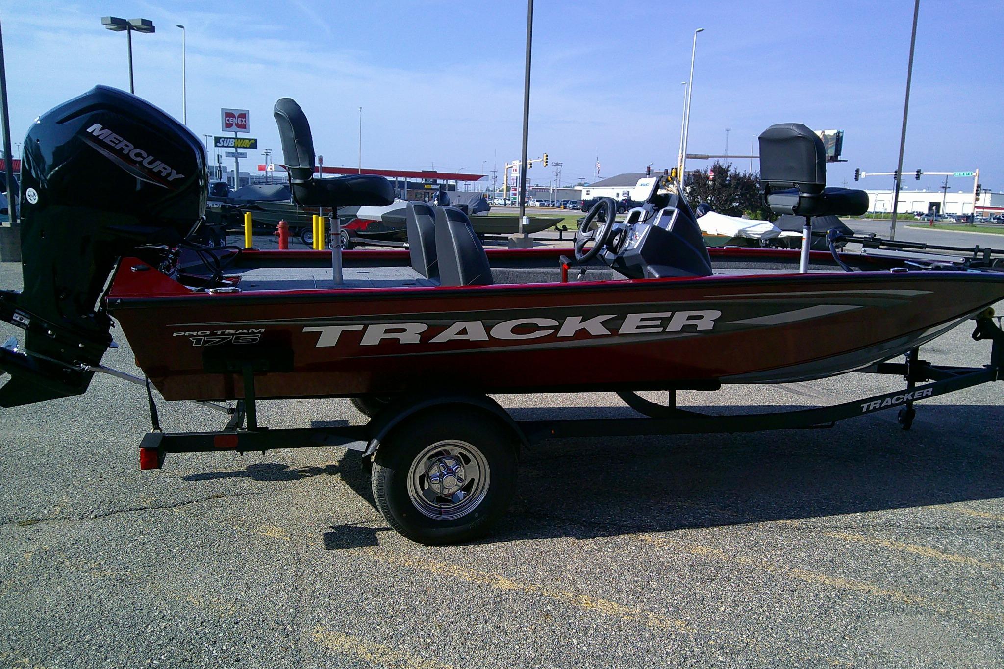 2025 Tracker Pro Team 175 boat on trailer in parking lot.