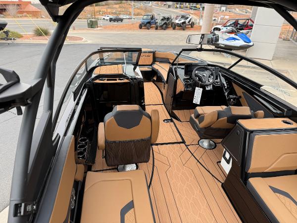 2025 Yamaha Boats 255XD interior with luxurious seating and modern dashboard design.