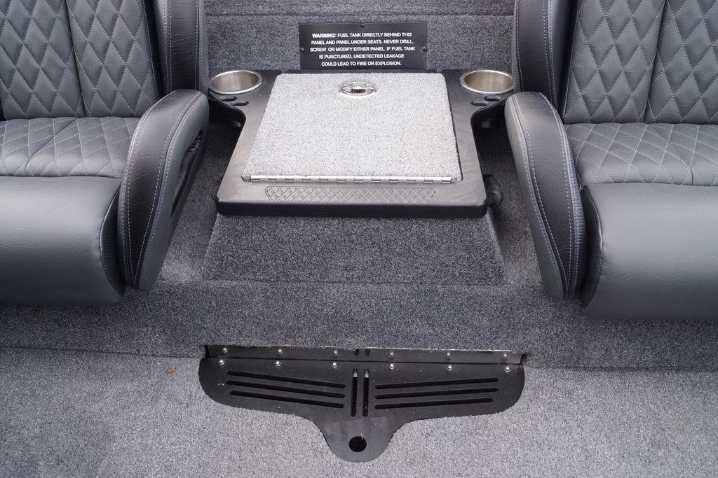 Interior of 2026 Phoenix 721 ZXL boat with cushioned seats and storage compartment.