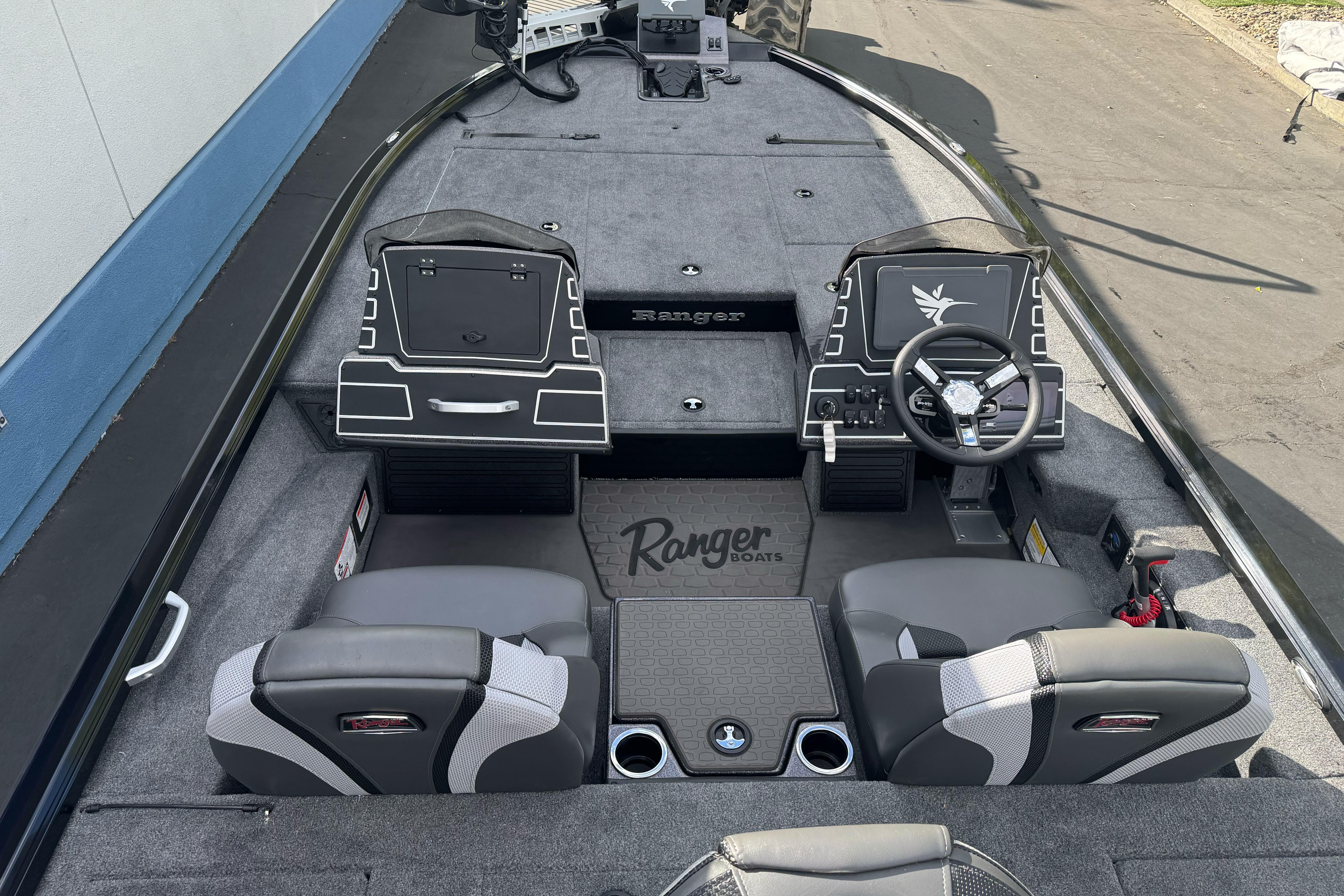 2026 Ranger ALPHA 208 boat interior with dual seats, steering wheel, and control panel.