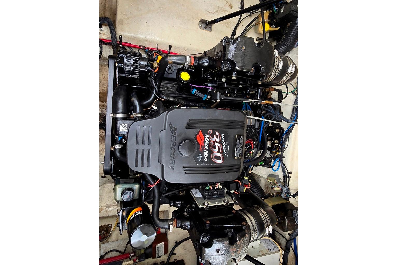 Engine of a 2006 Sea Ray 240 Sundancer boat, featuring a MerCruiser 350 MAG MPI.