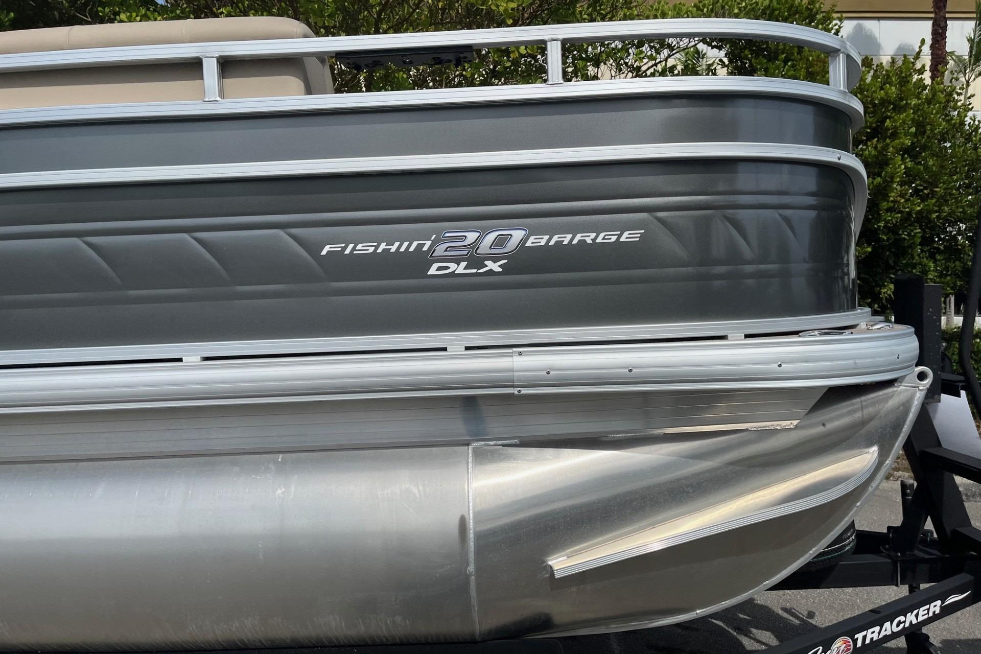 2025 Sun Tracker Fishin' Barge 20 DLX pontoon boat, side view, gray exterior.