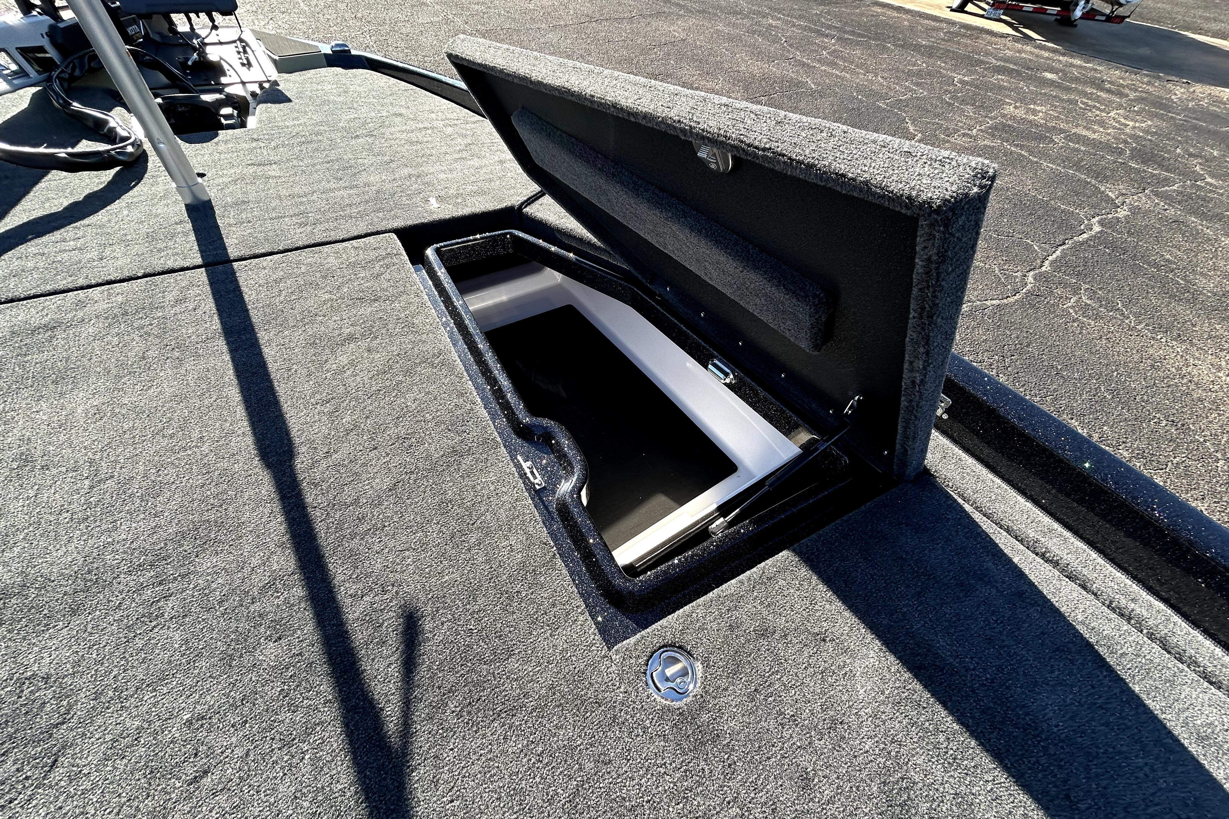 Open storage compartment on 2026 Skeeter ZXE21 boat deck.
