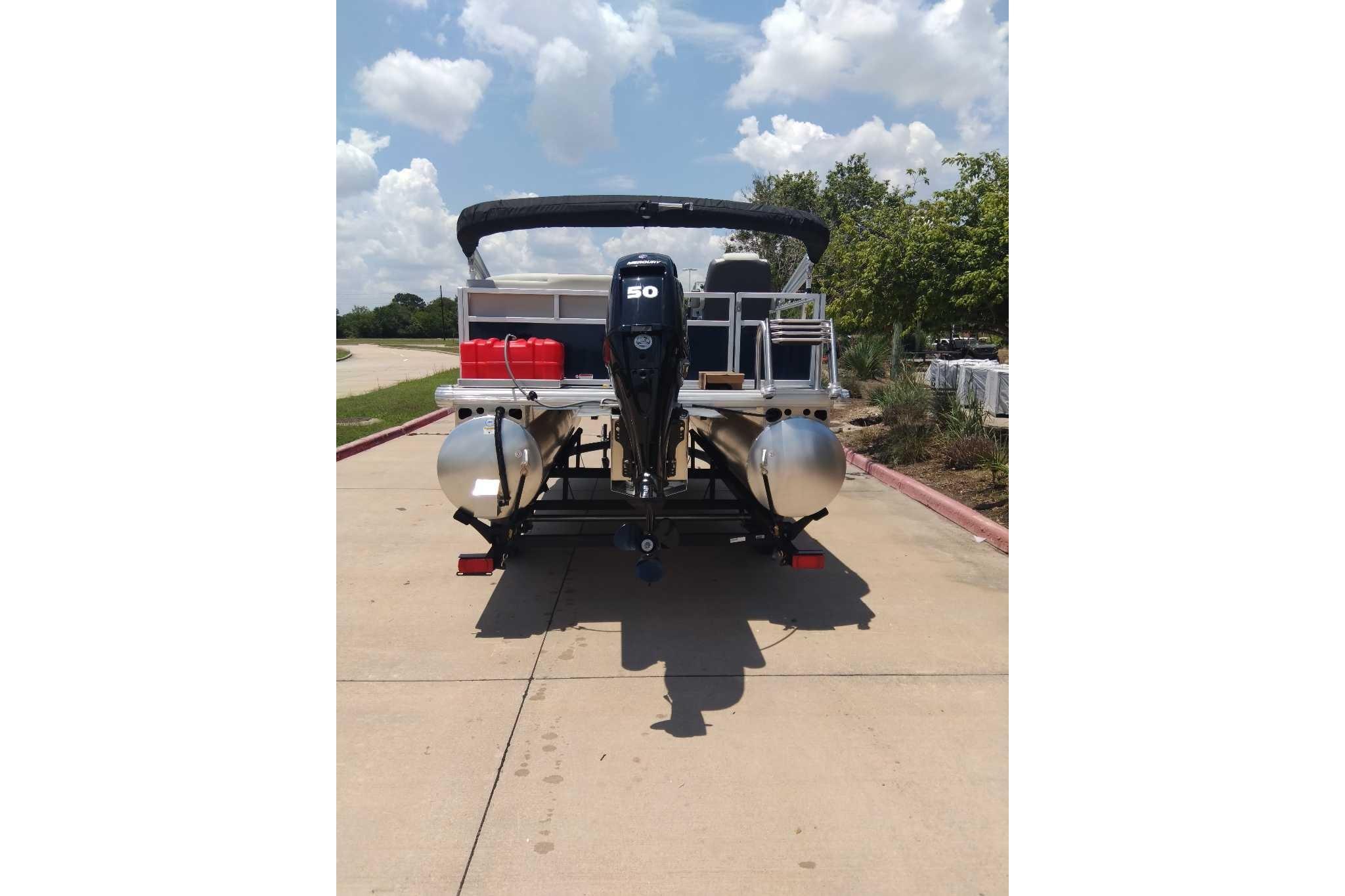 2026 Sun Tracker Bass Buggy 16 XL Select pontoon boat on a sunny day.