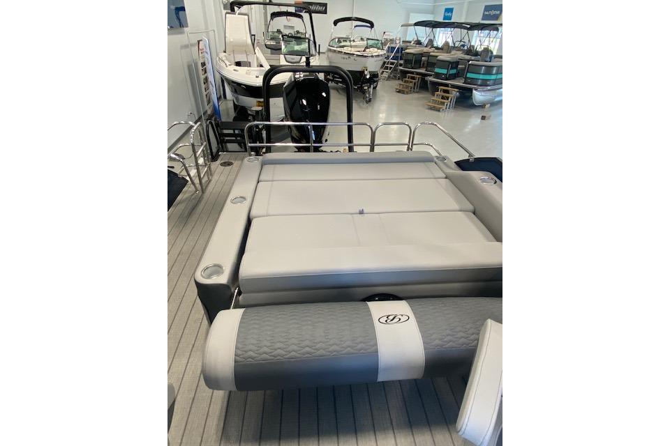 2026 Bentley Pontoons Elite 223 Swingback with spacious seating in showroom.