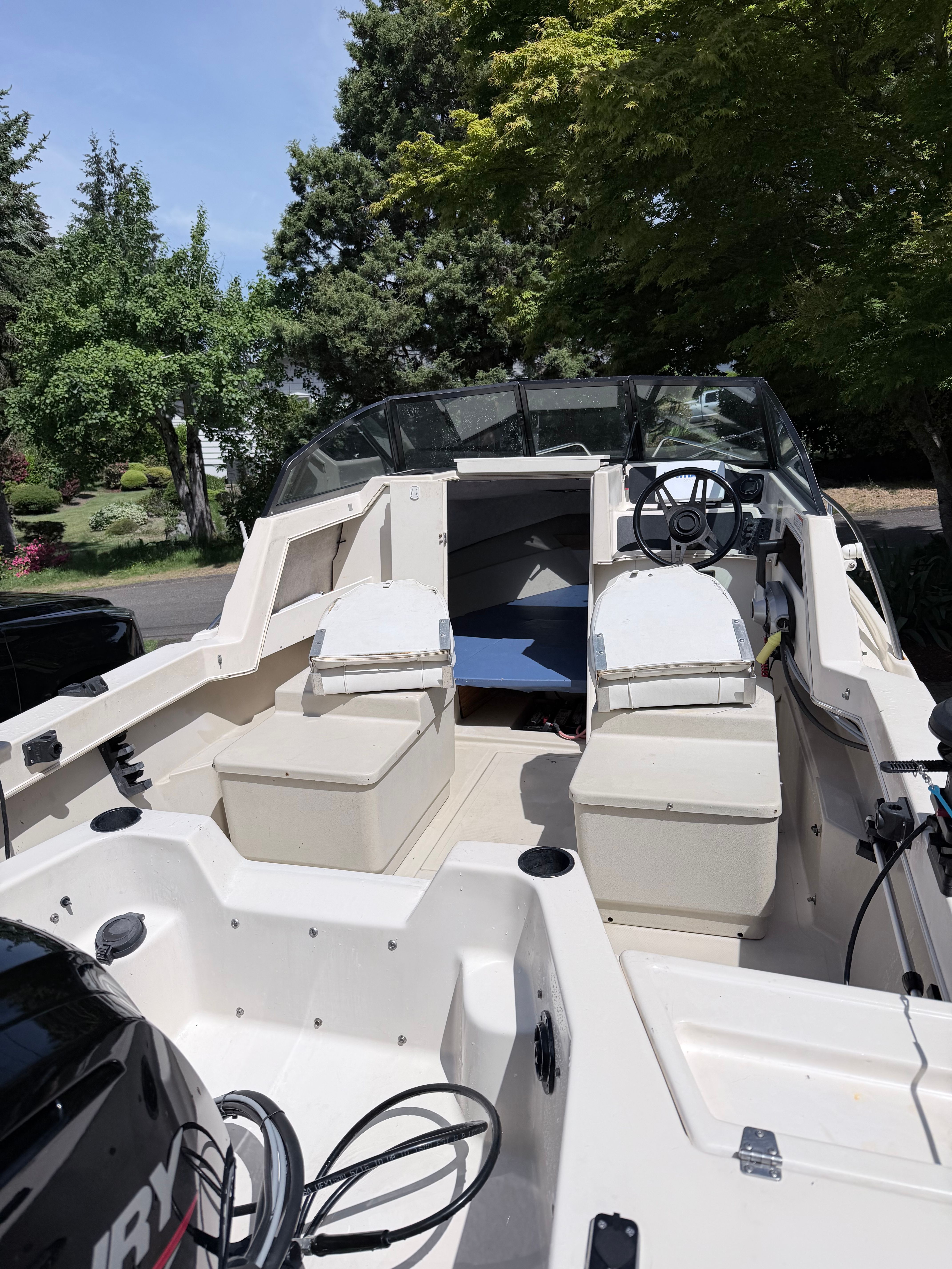 A 1993 Arima Sea Explorer 1511 with two seats and an open helm area.