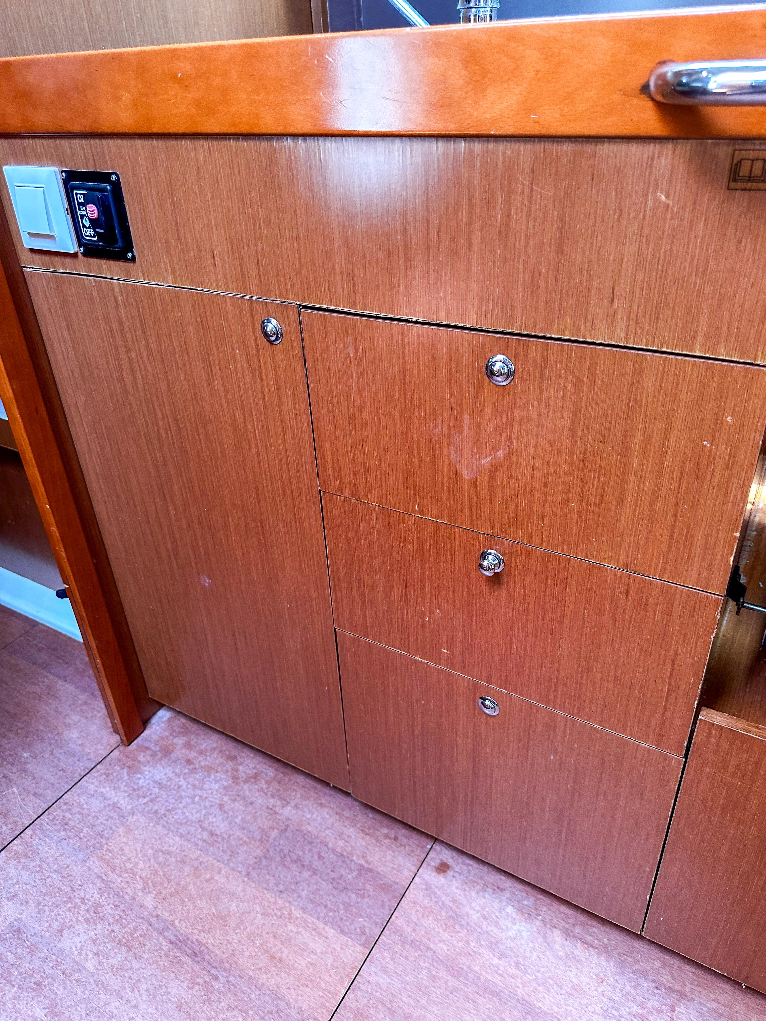 Wooden cabinetry in a 2018 Beneteau Oceanis 41.1 yacht interior.