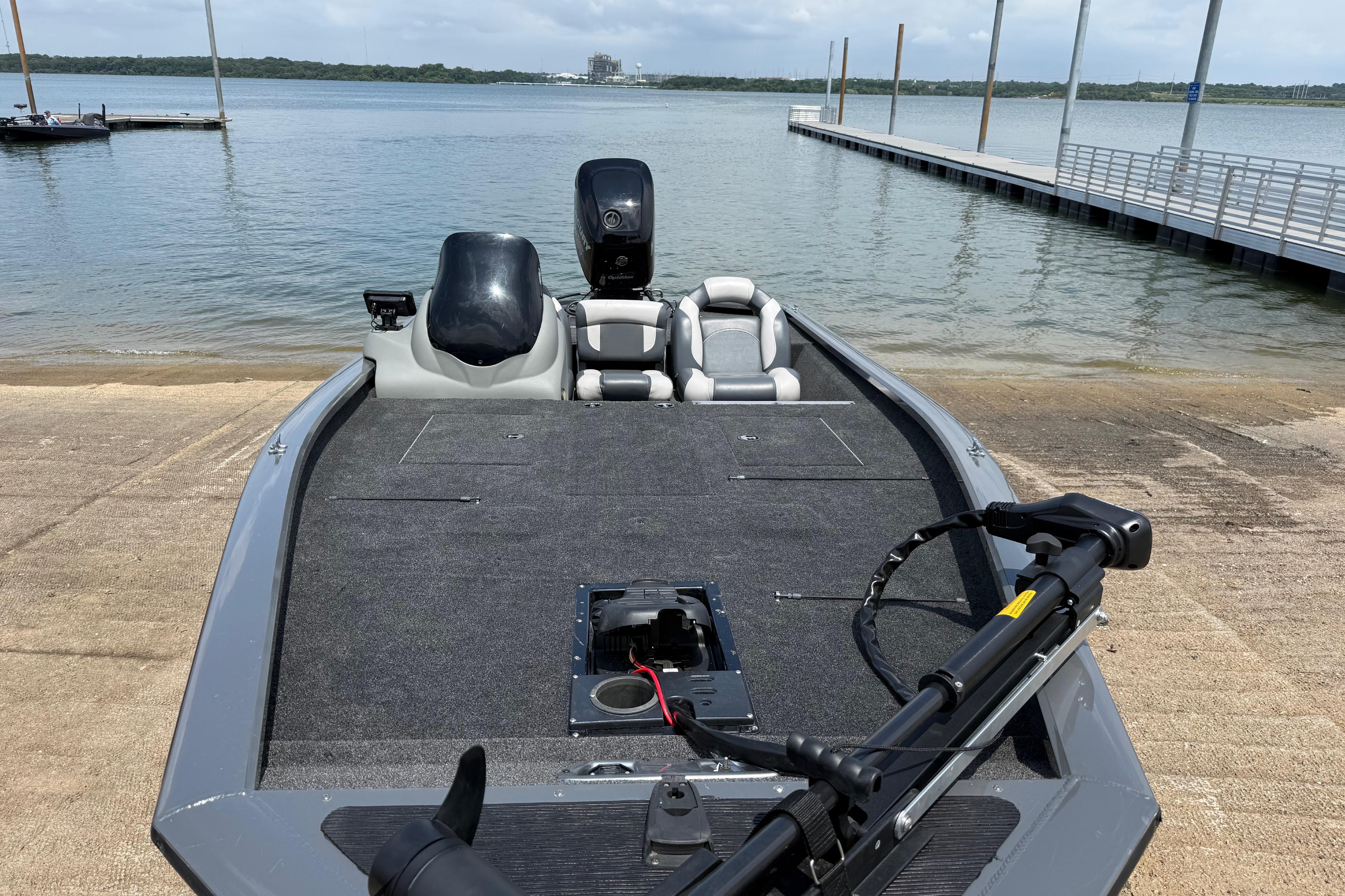 2015 Tracker Pro Team 190 TX boat at a lakeside dock, ready for launch.